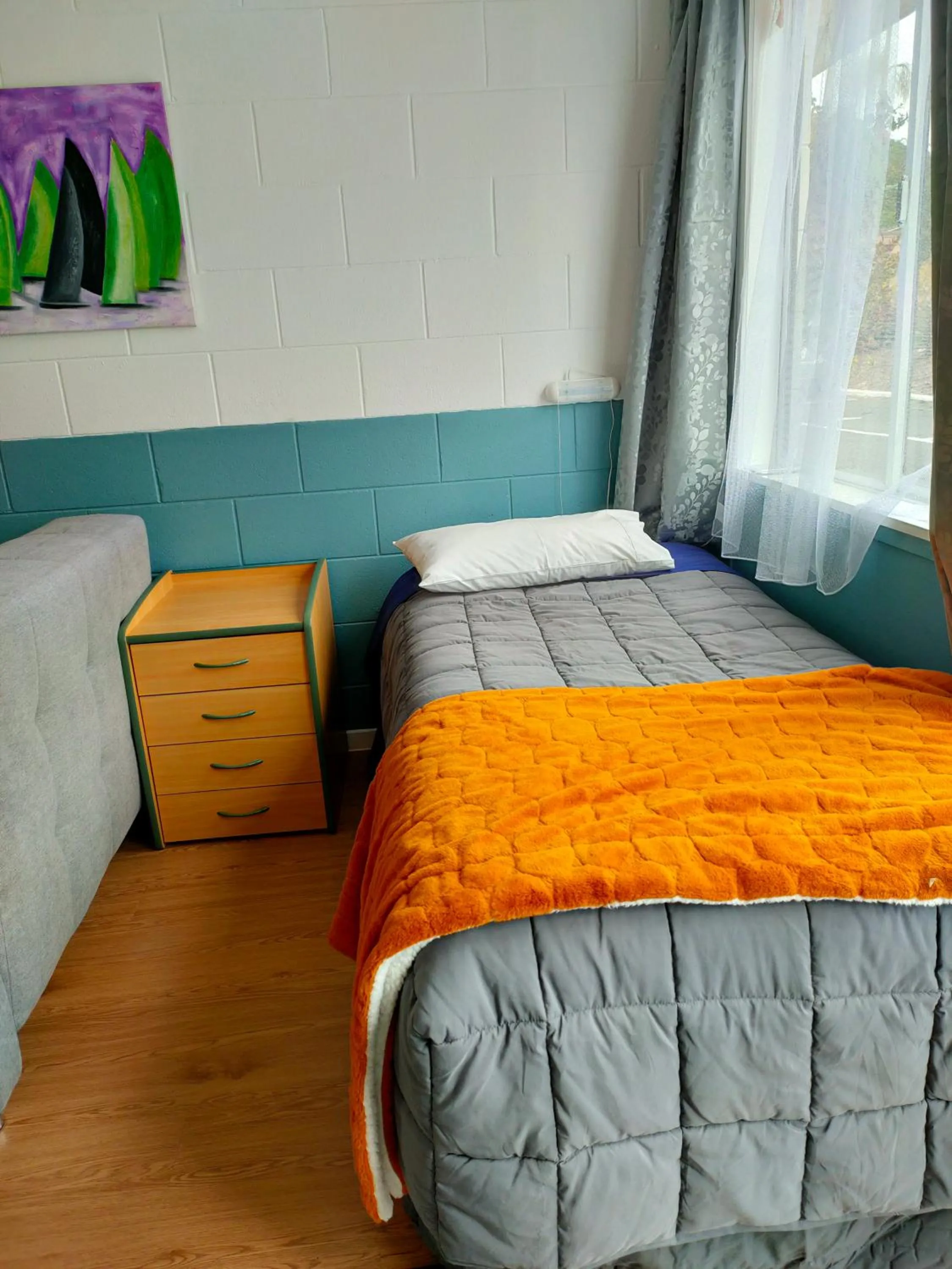 Bed in Aarangi Tui Motel