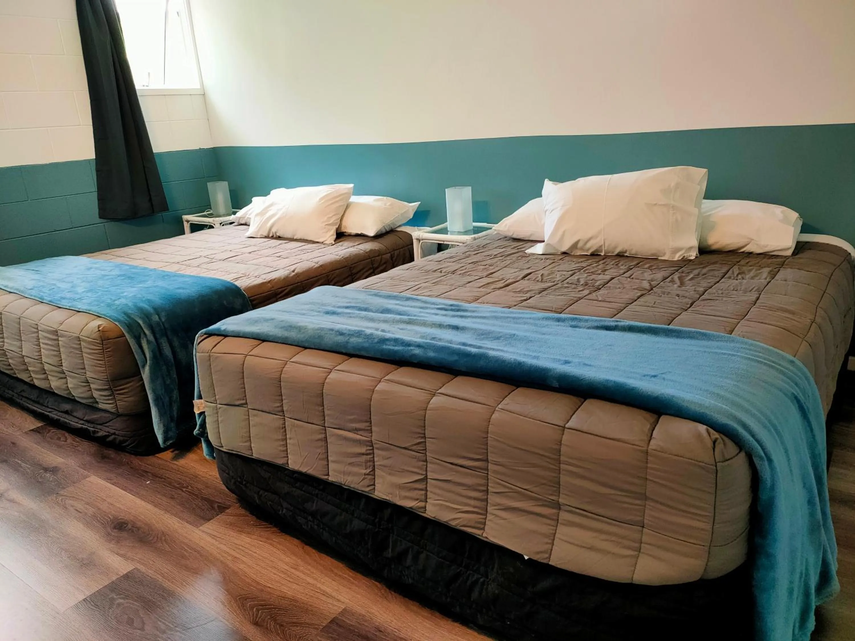 Bed in Aarangi Tui Motel