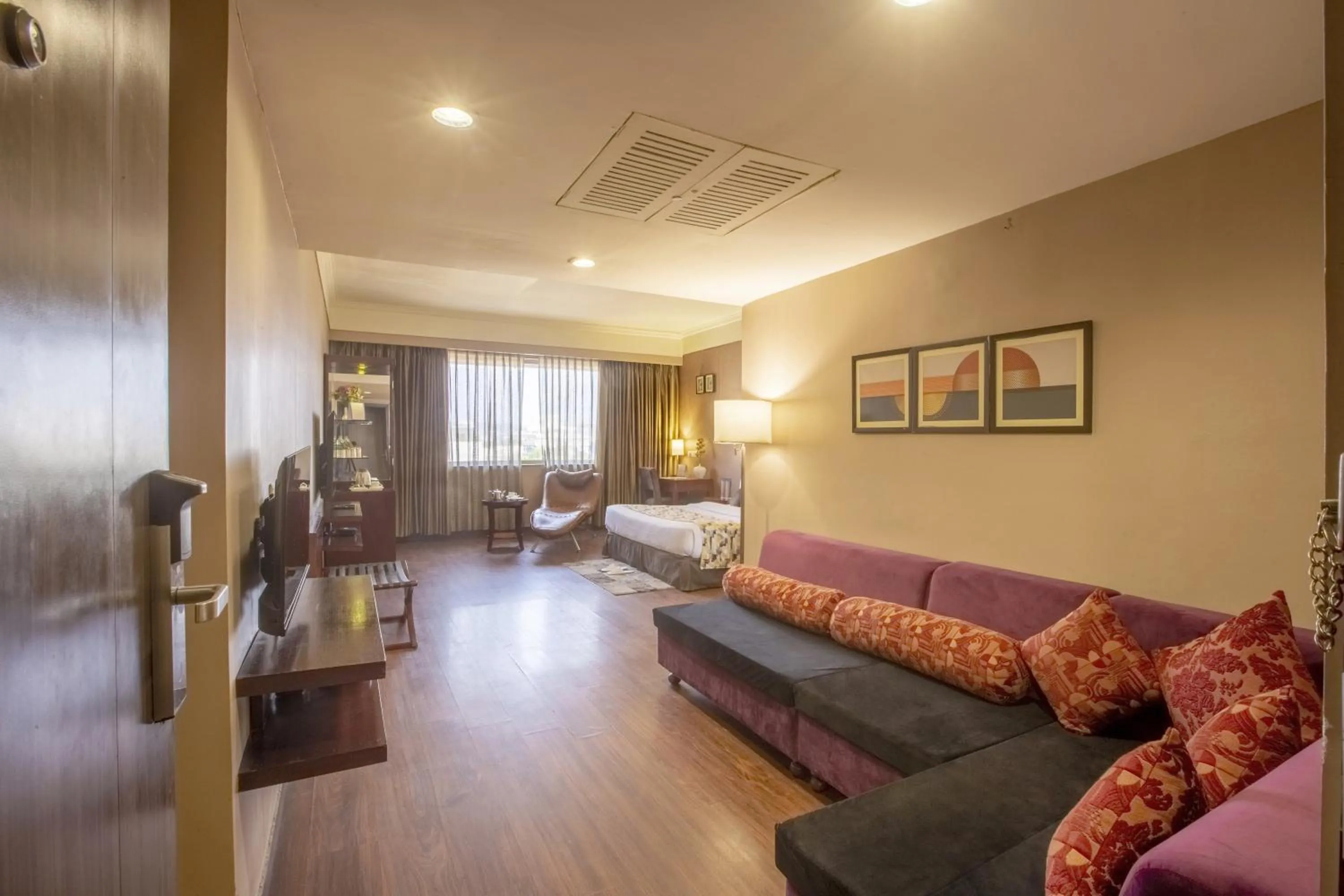 Communal lounge/ TV room in Vesta Maurya Palace