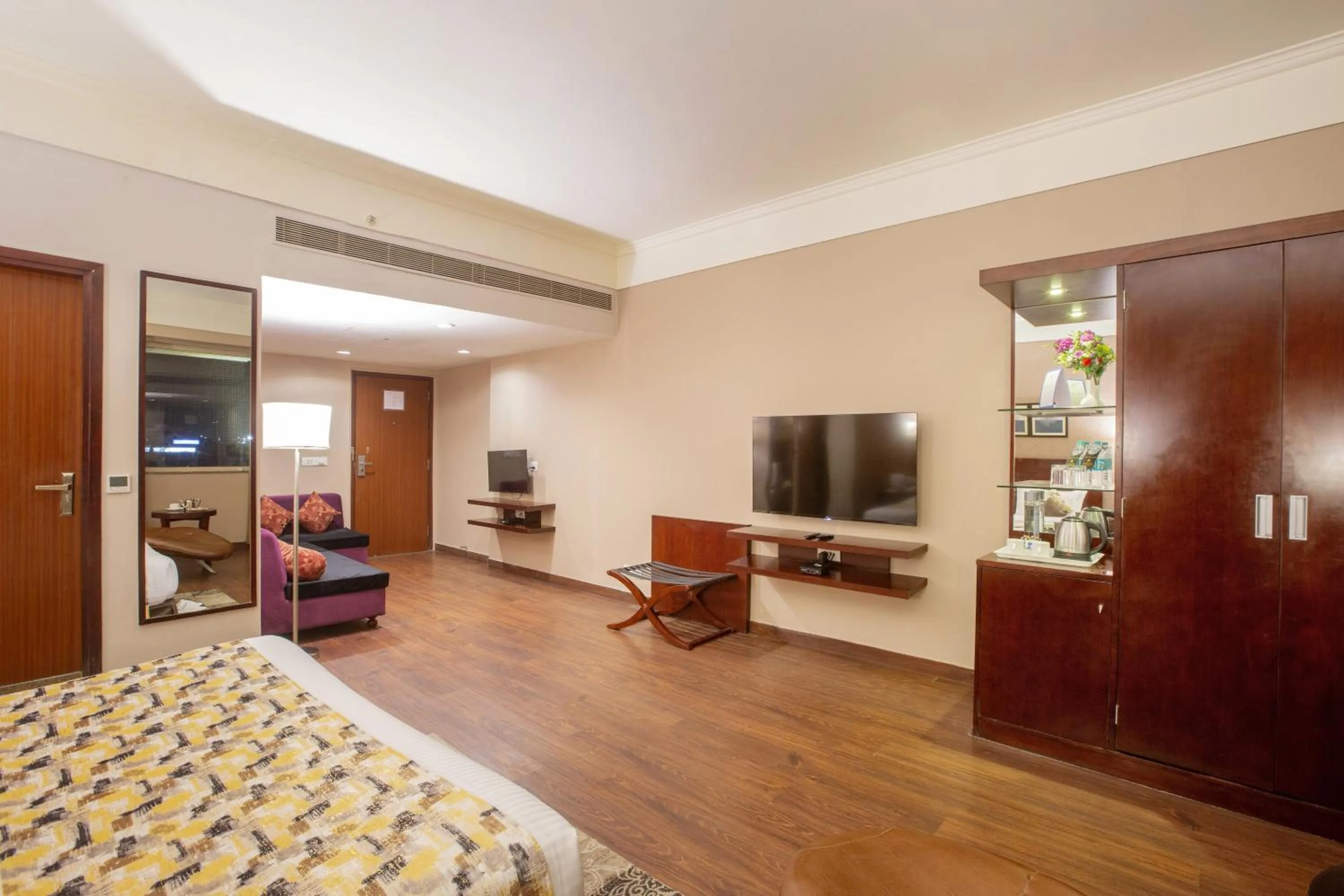 Communal lounge/ TV room, Bed in Vesta Maurya Palace