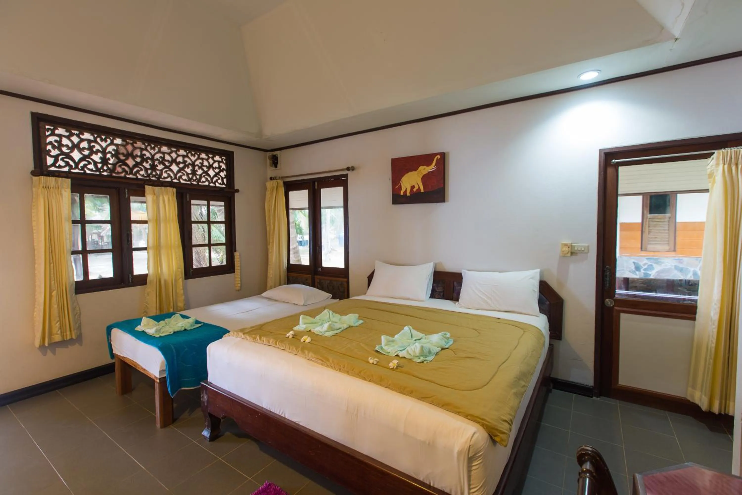 Bed in Koh Talu Island Resort