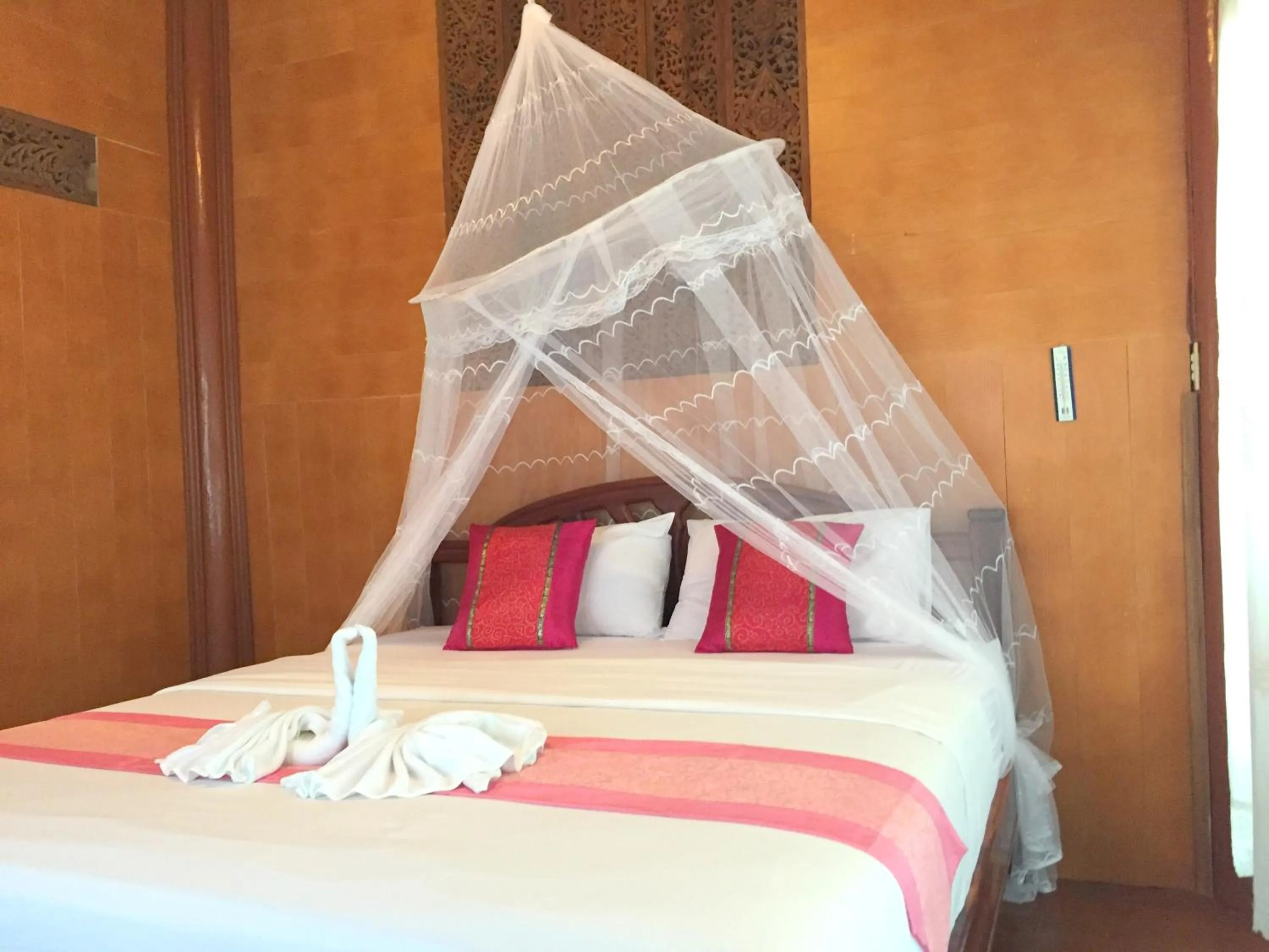 Bed in Koh Talu Island Resort