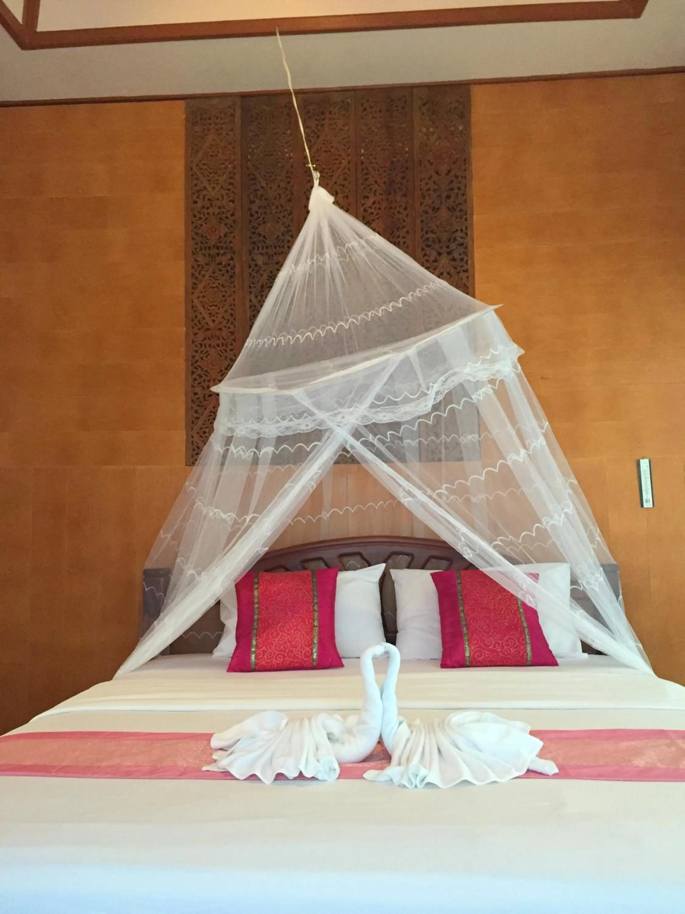 Bed in Koh Talu Island Resort