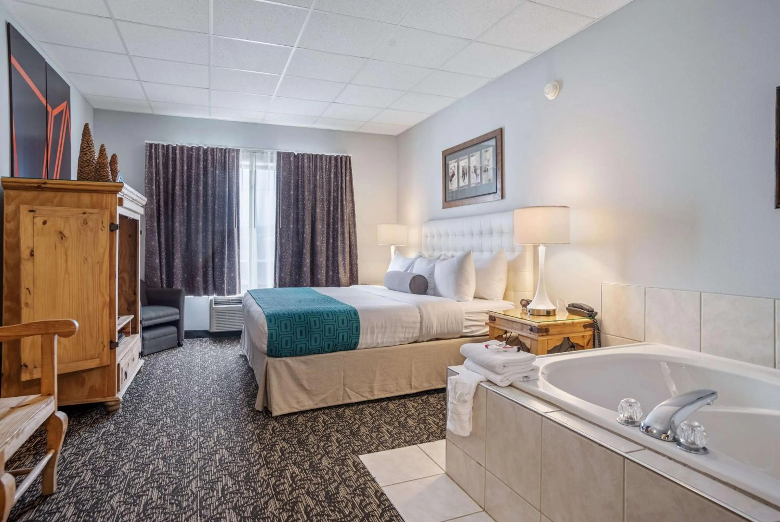 Bed in Elevation Inn & Suites, Trademark Collection by Wyndham