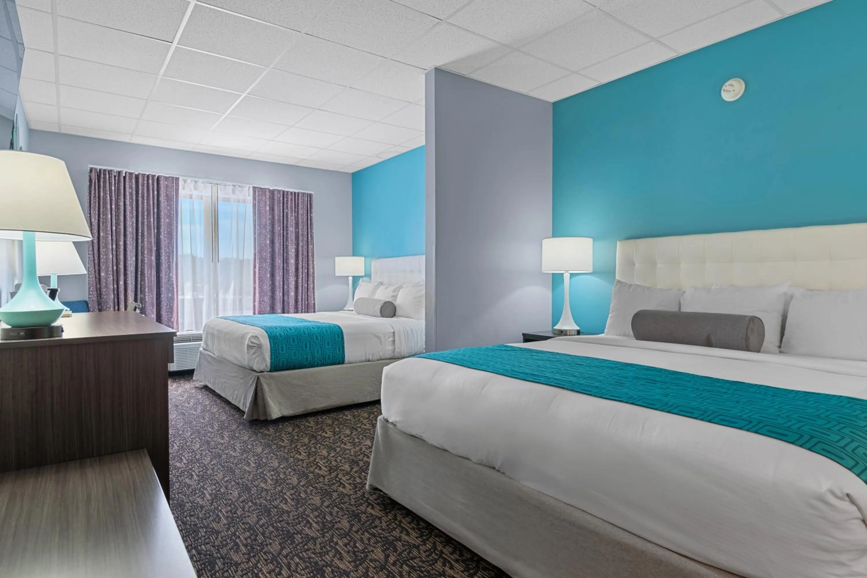 Bed in Elevation Inn & Suites, Trademark Collection by Wyndham