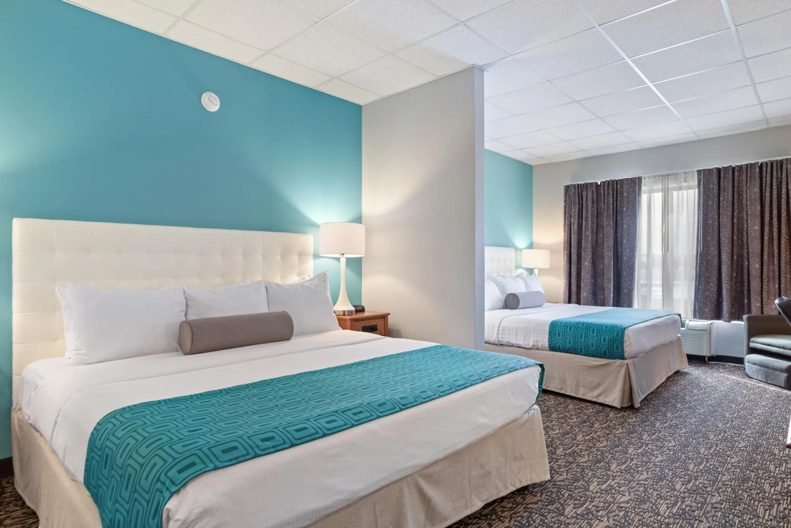 Bed in Elevation Inn & Suites, Trademark Collection by Wyndham