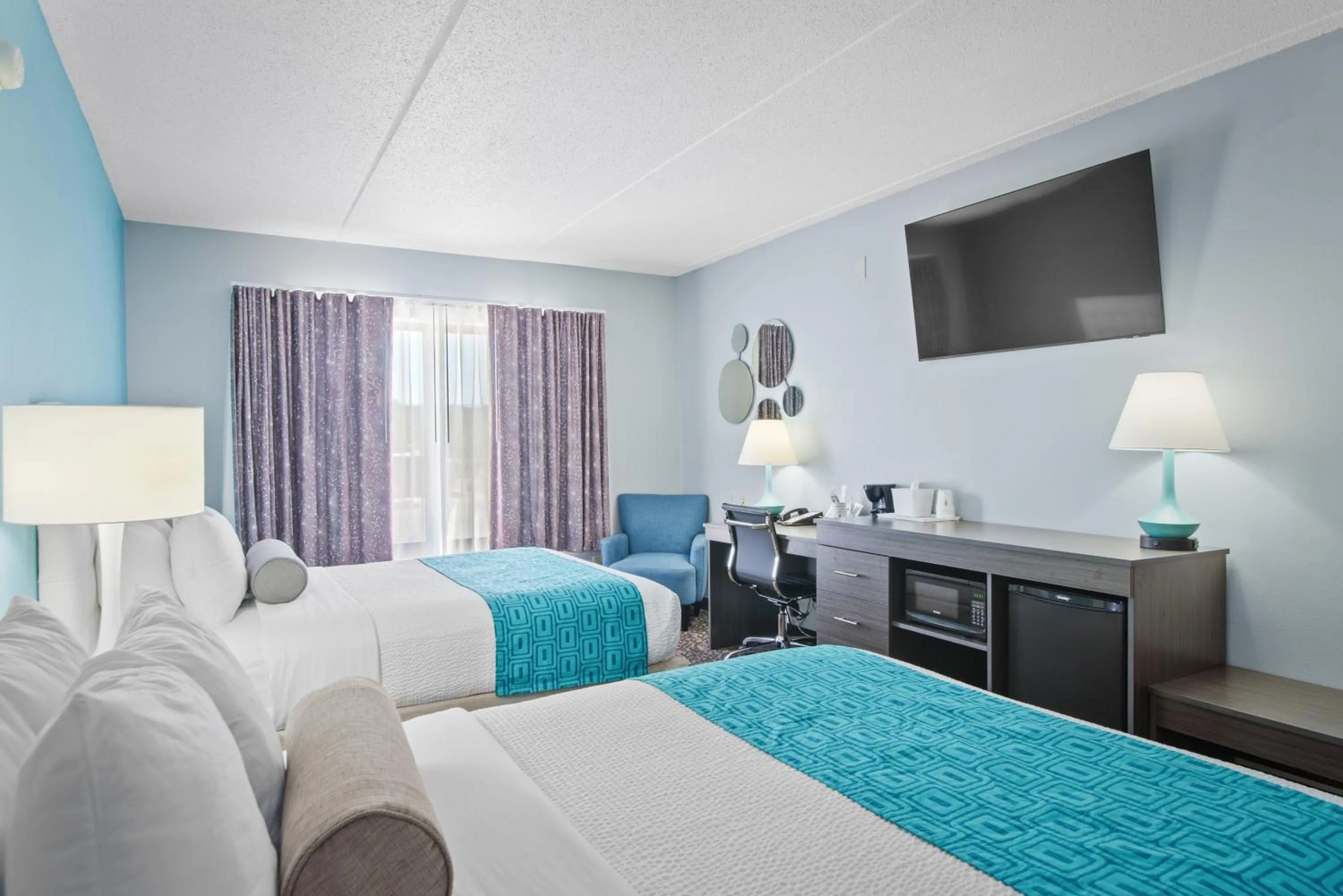 Bed in Elevation Inn & Suites, Trademark Collection by Wyndham