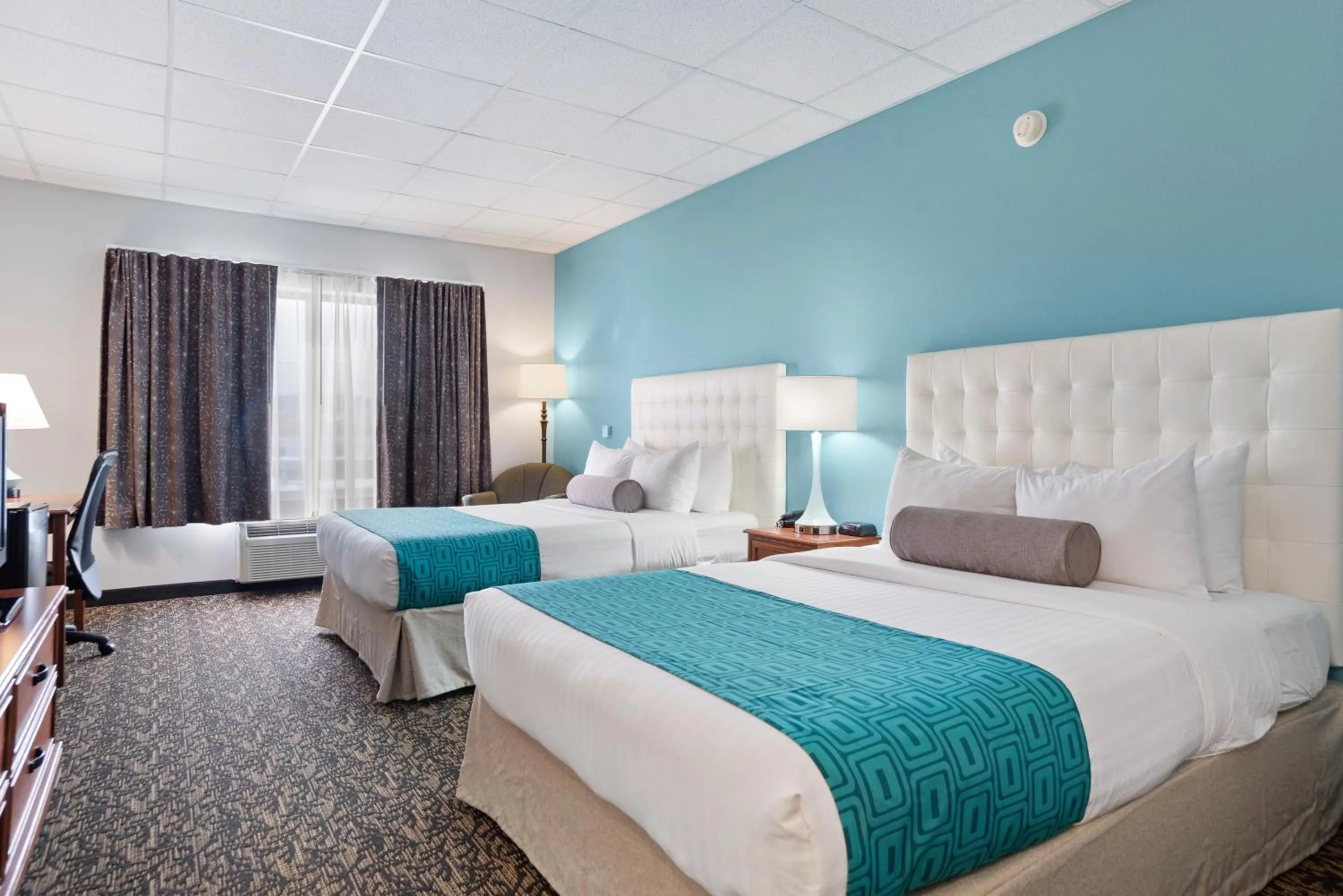 Bed in Elevation Inn & Suites, Trademark Collection by Wyndham