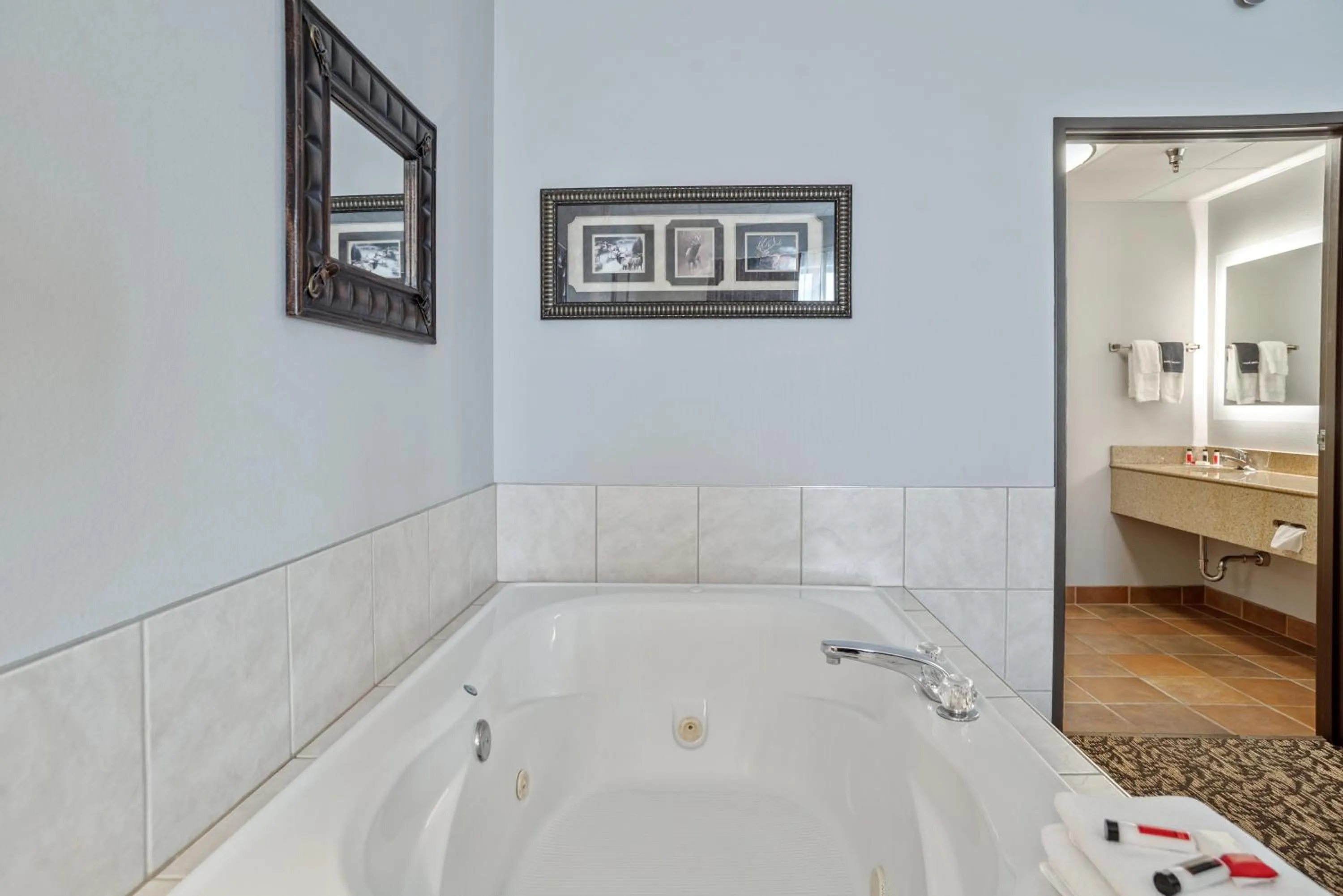 Bathroom in Elevation Inn & Suites, Trademark Collection by Wyndham