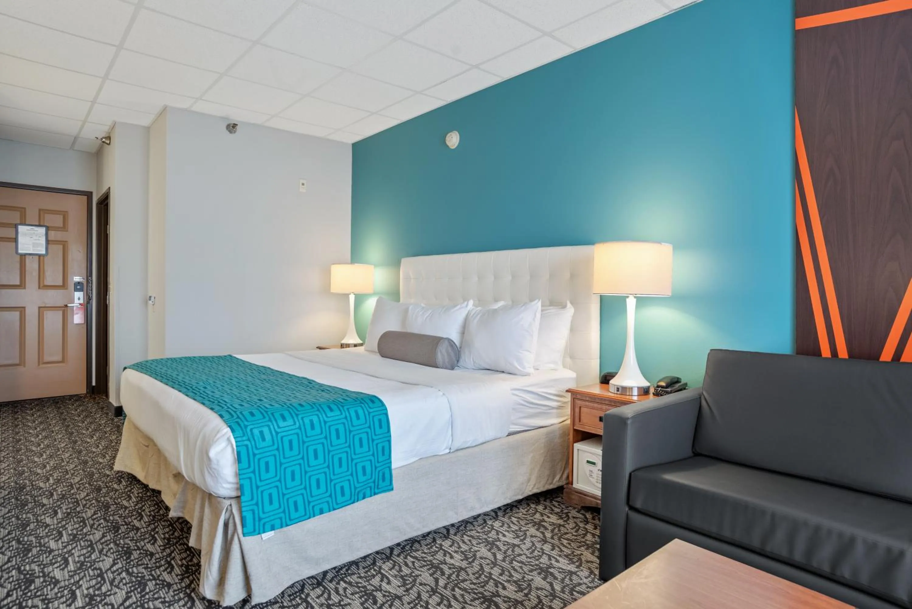 Bed in Elevation Inn & Suites, Trademark Collection by Wyndham