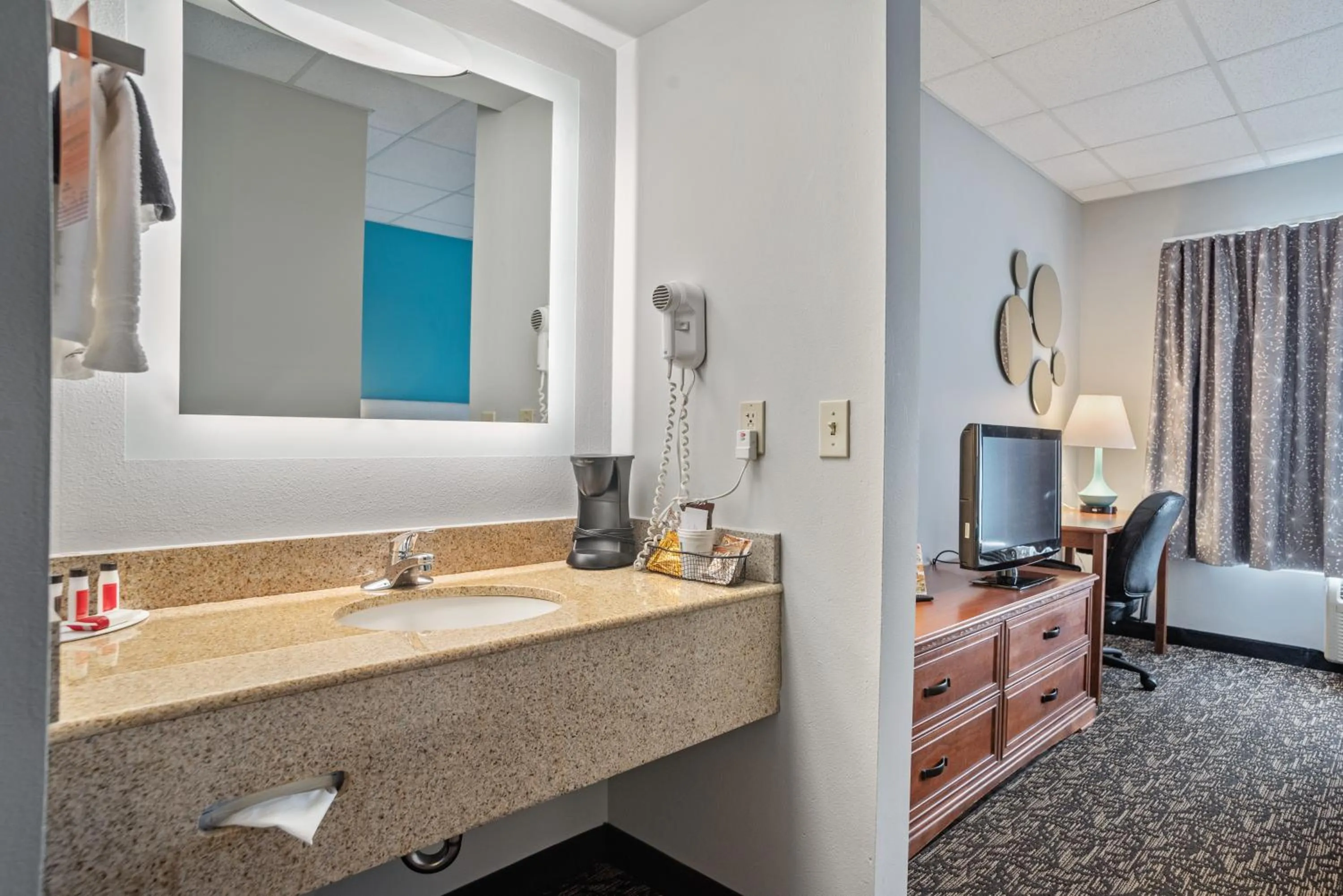 Bathroom in Elevation Inn & Suites, Trademark Collection by Wyndham