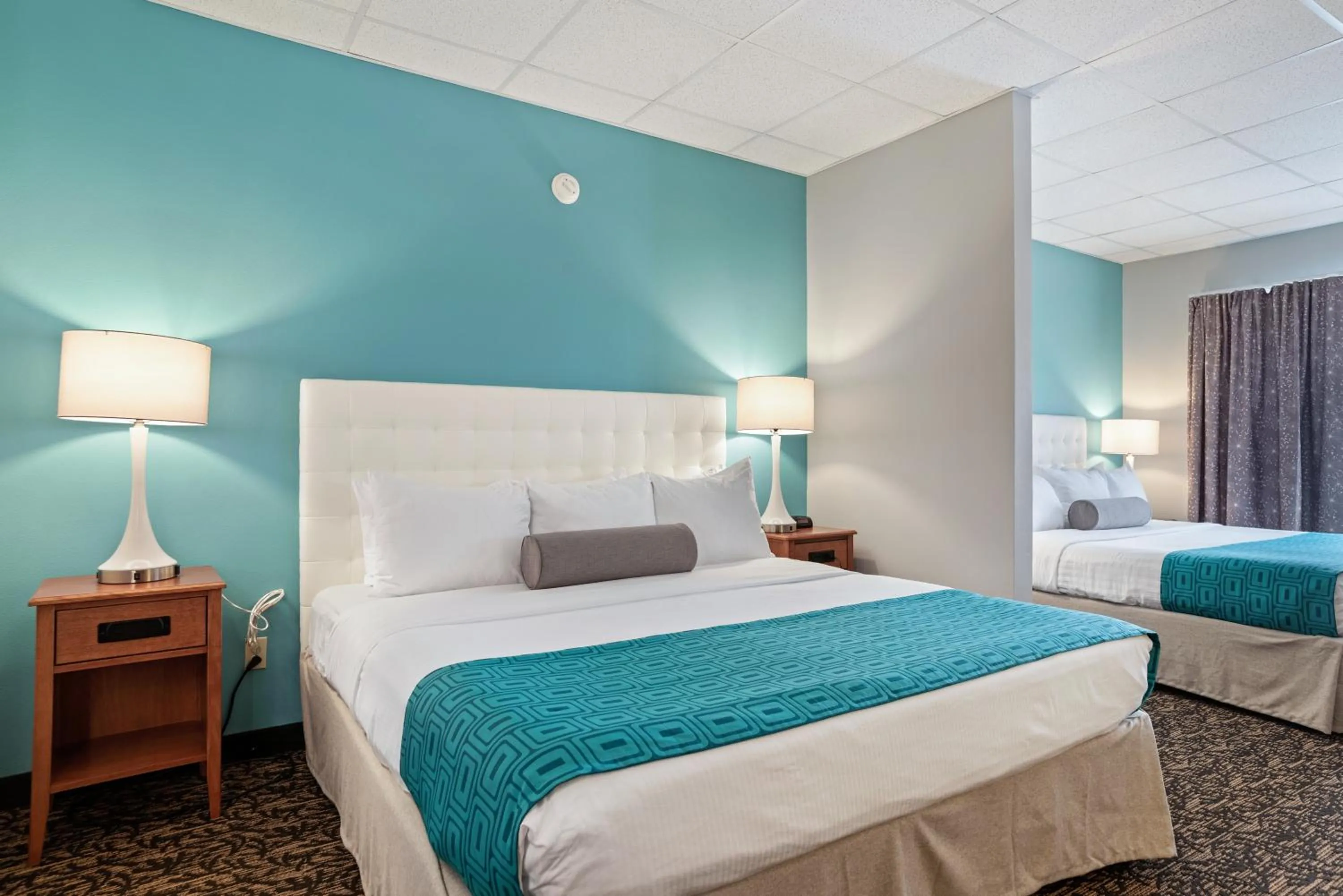 Bed in Elevation Inn & Suites, Trademark Collection by Wyndham