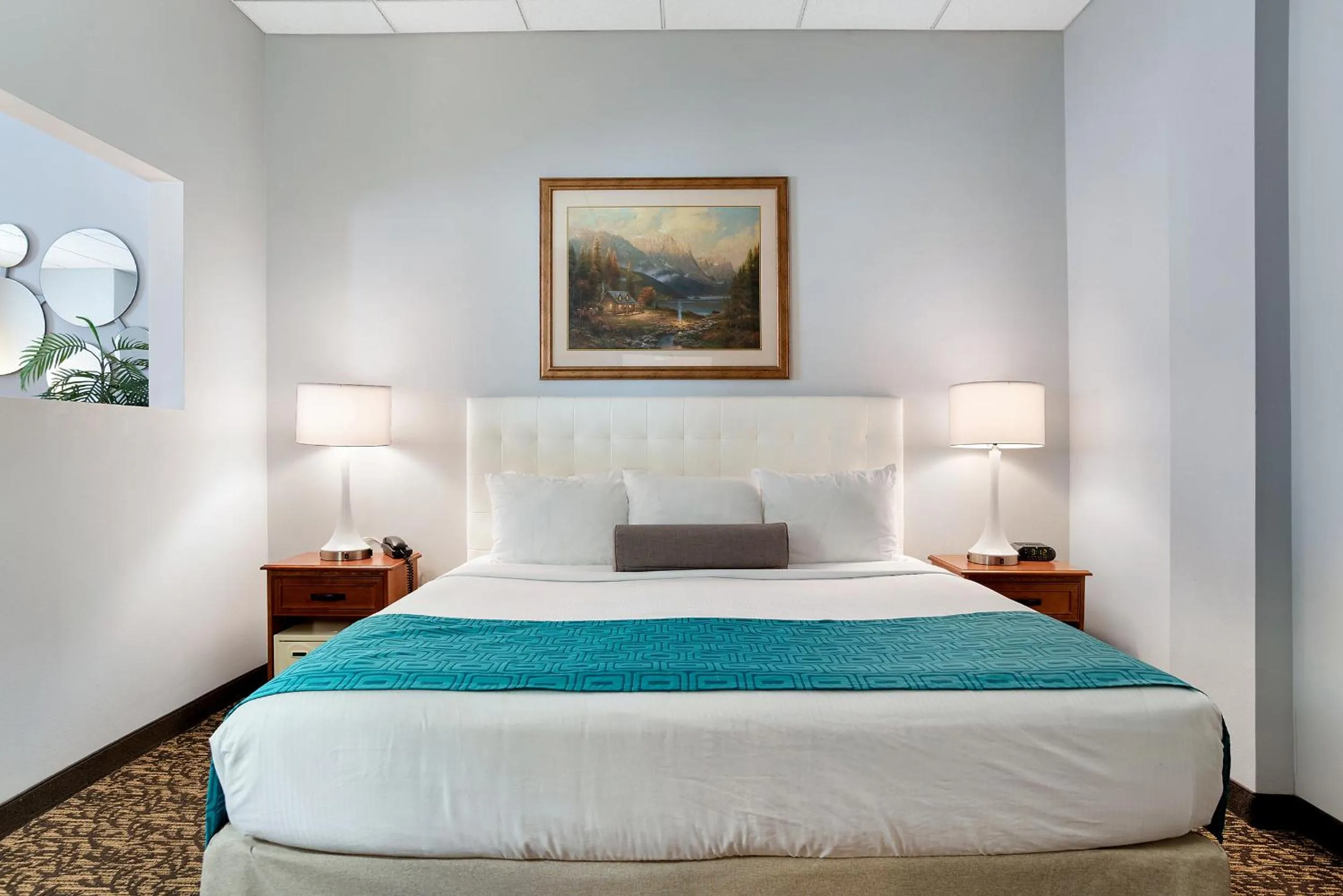Bed in Elevation Inn & Suites, Trademark Collection by Wyndham