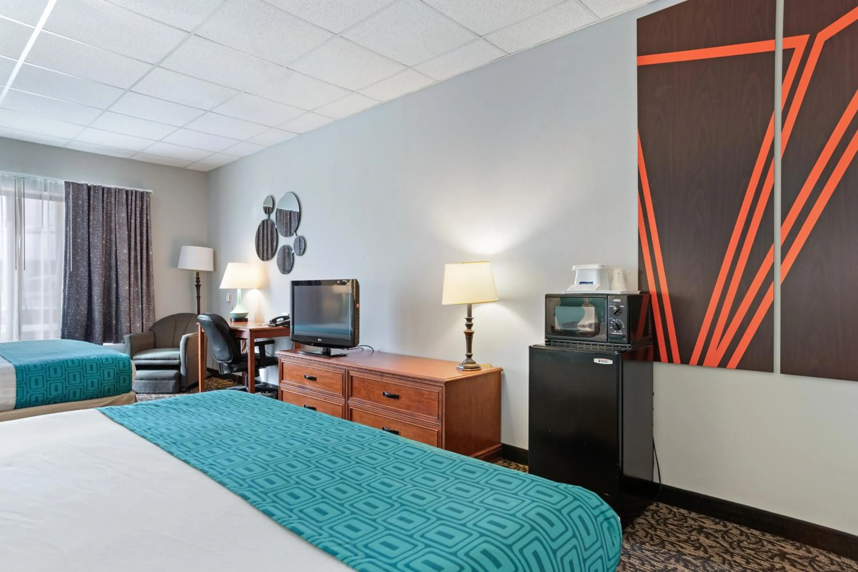 Bed in Elevation Inn & Suites, Trademark Collection by Wyndham