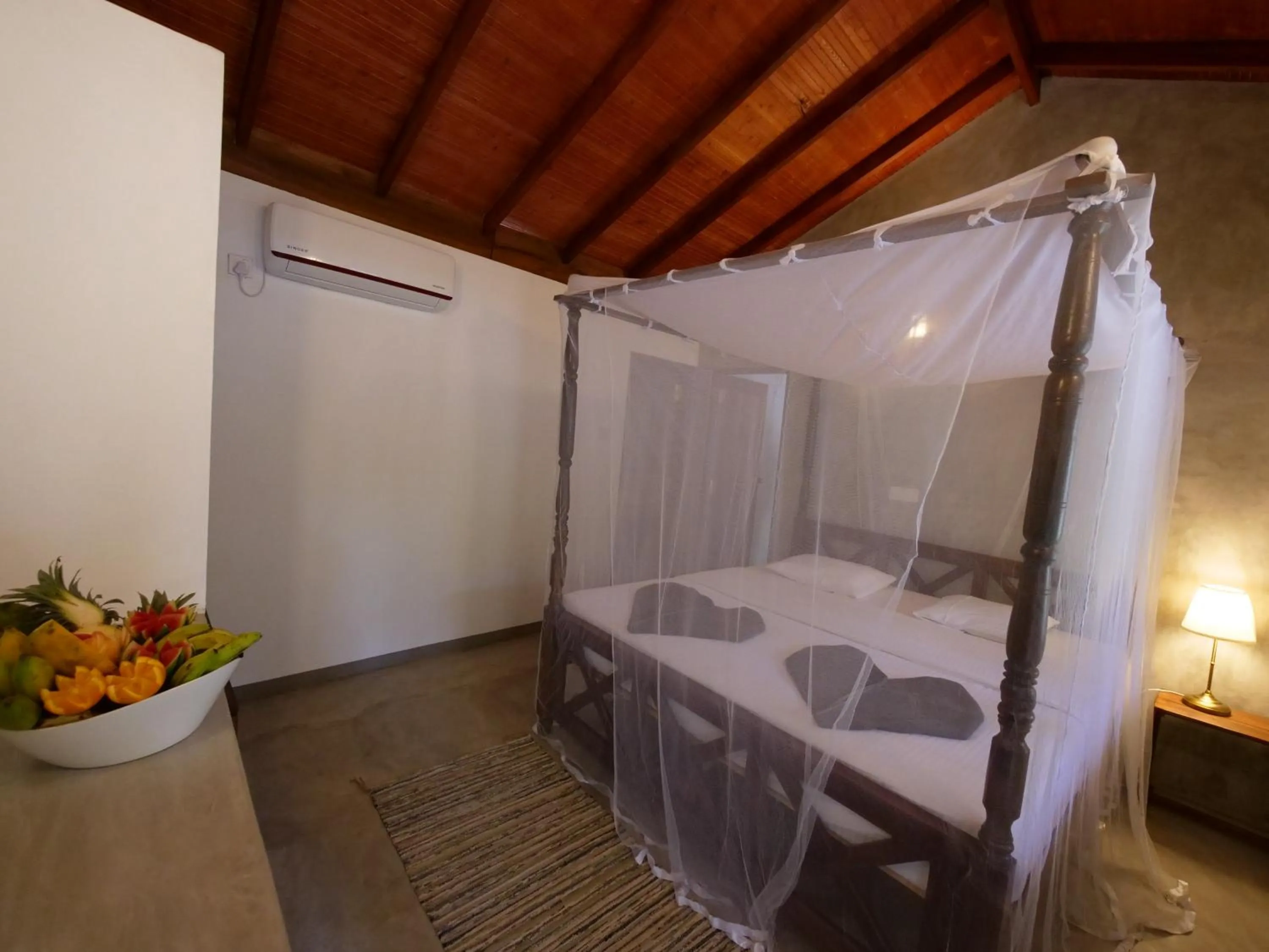 Bed in De Silva Palm Resort