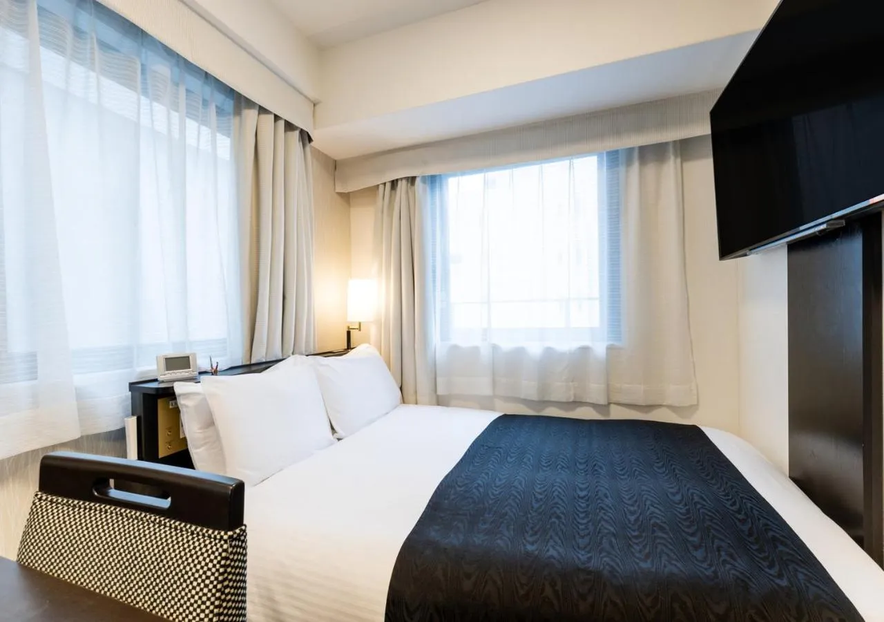 Bed in APA Hotel Midosuji Honmachi Ekihigashi