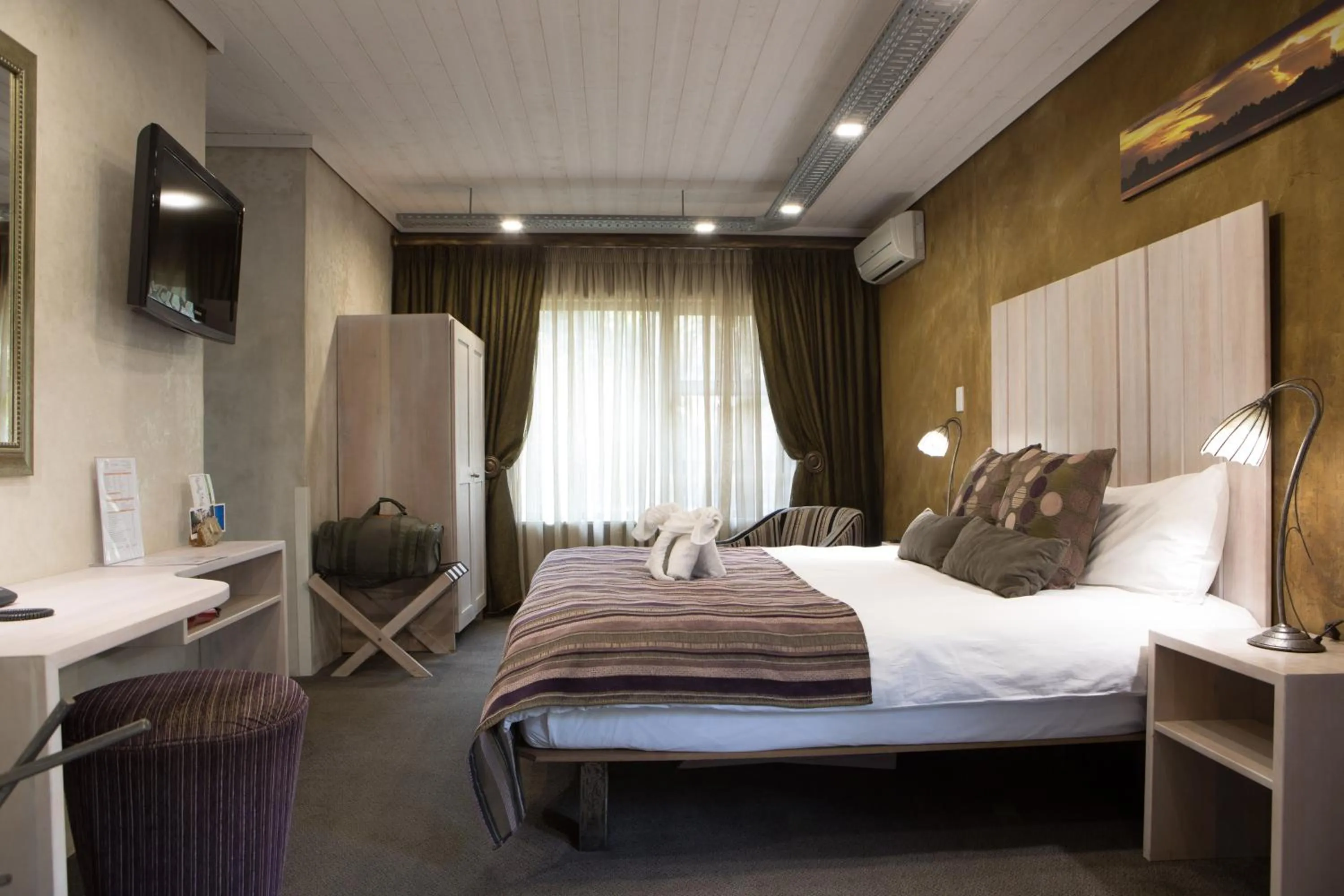 Bed in African Rock Hotel & Spa, a "Boutique Lifestyle Resort"