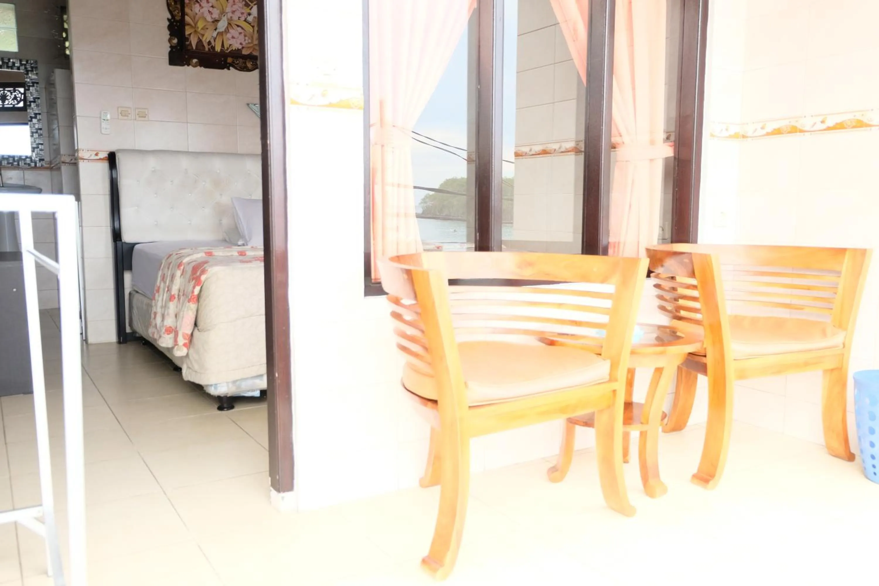 Balcony/Terrace, Bed in Kerti Beach Bungalow and Restaurant