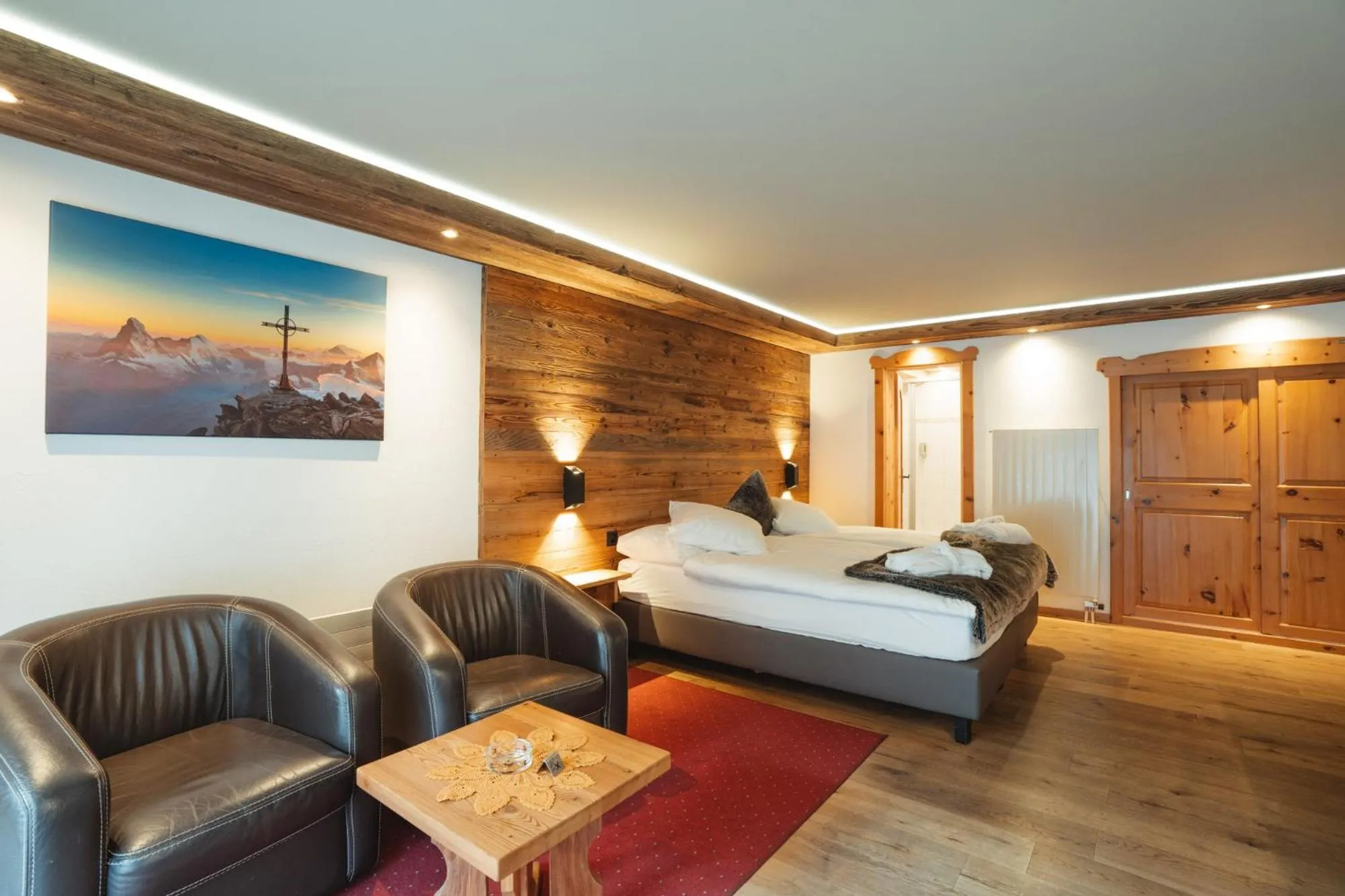 Living room, Bed in Hotel Matterhornblick