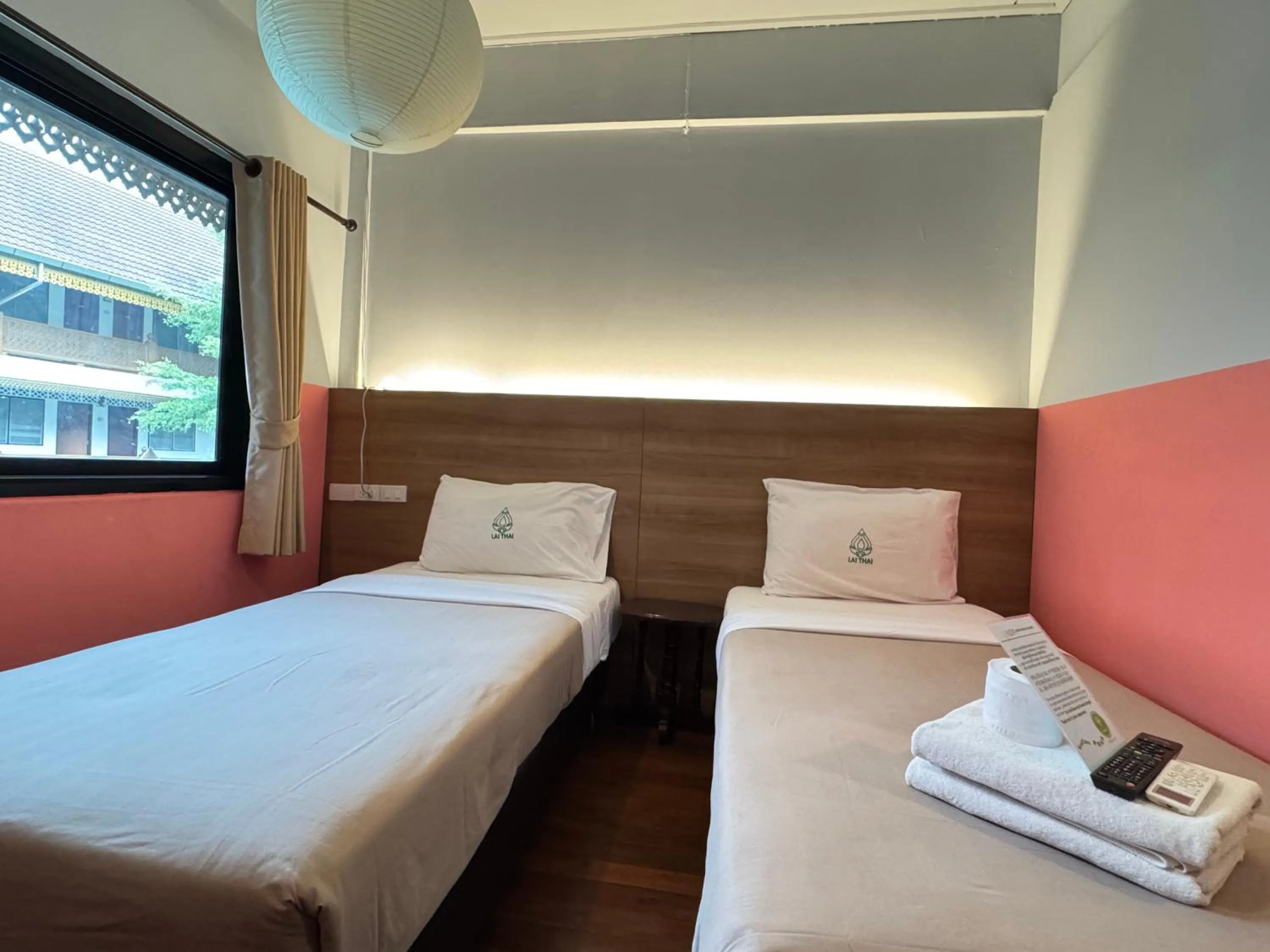 Bed in Lai Thai Guest House