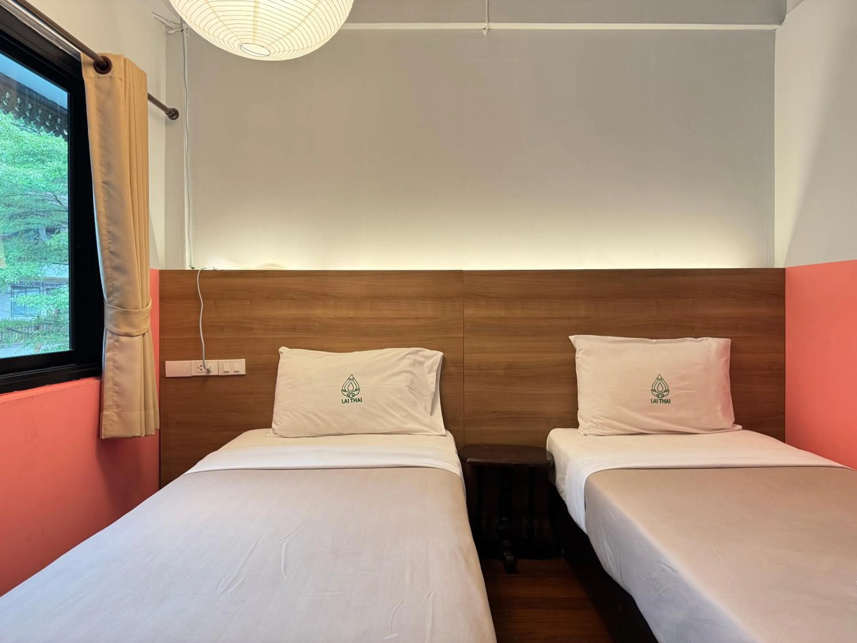 Bed in Lai Thai Guest House