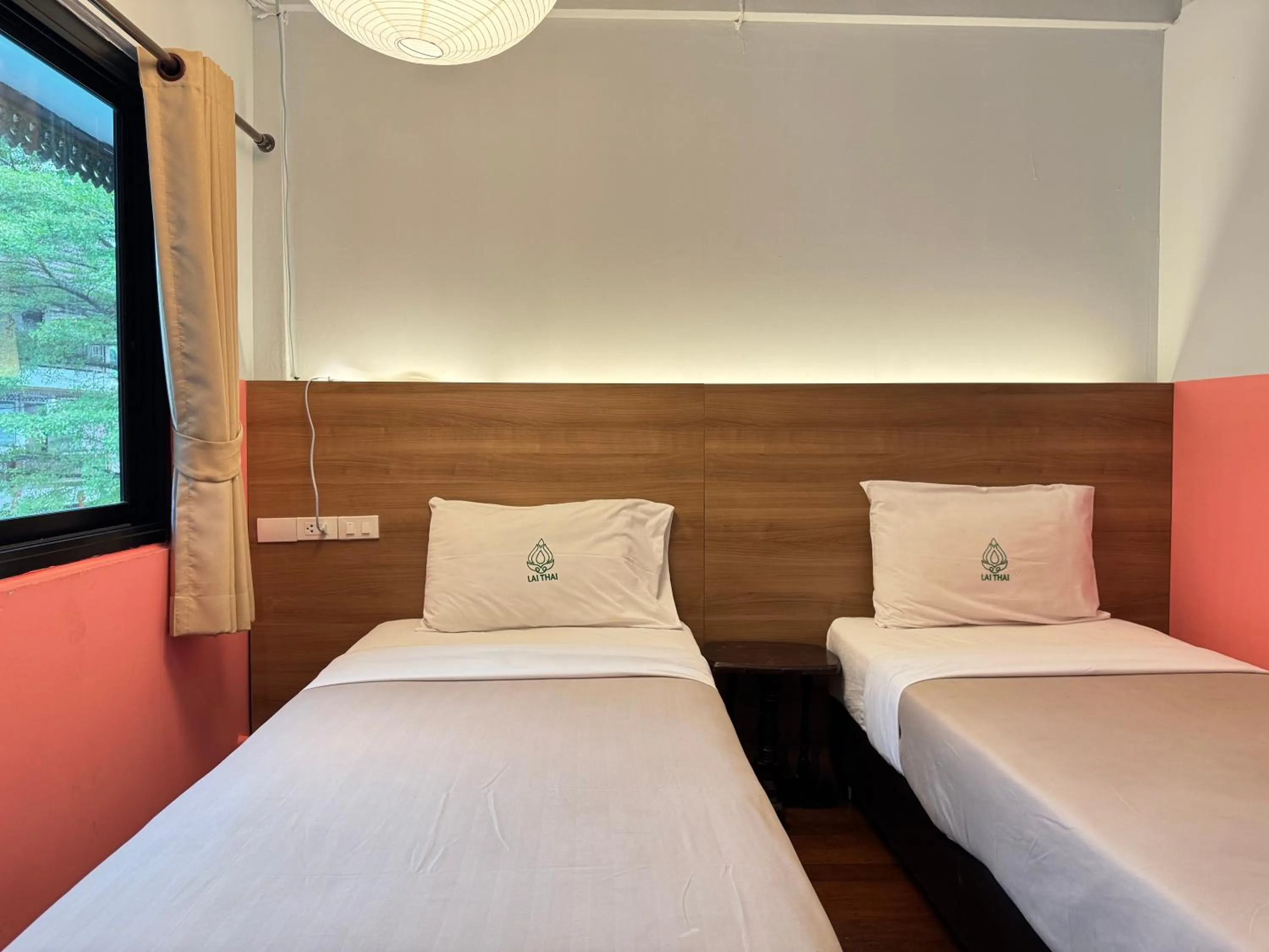 Bed in Lai Thai Guest House