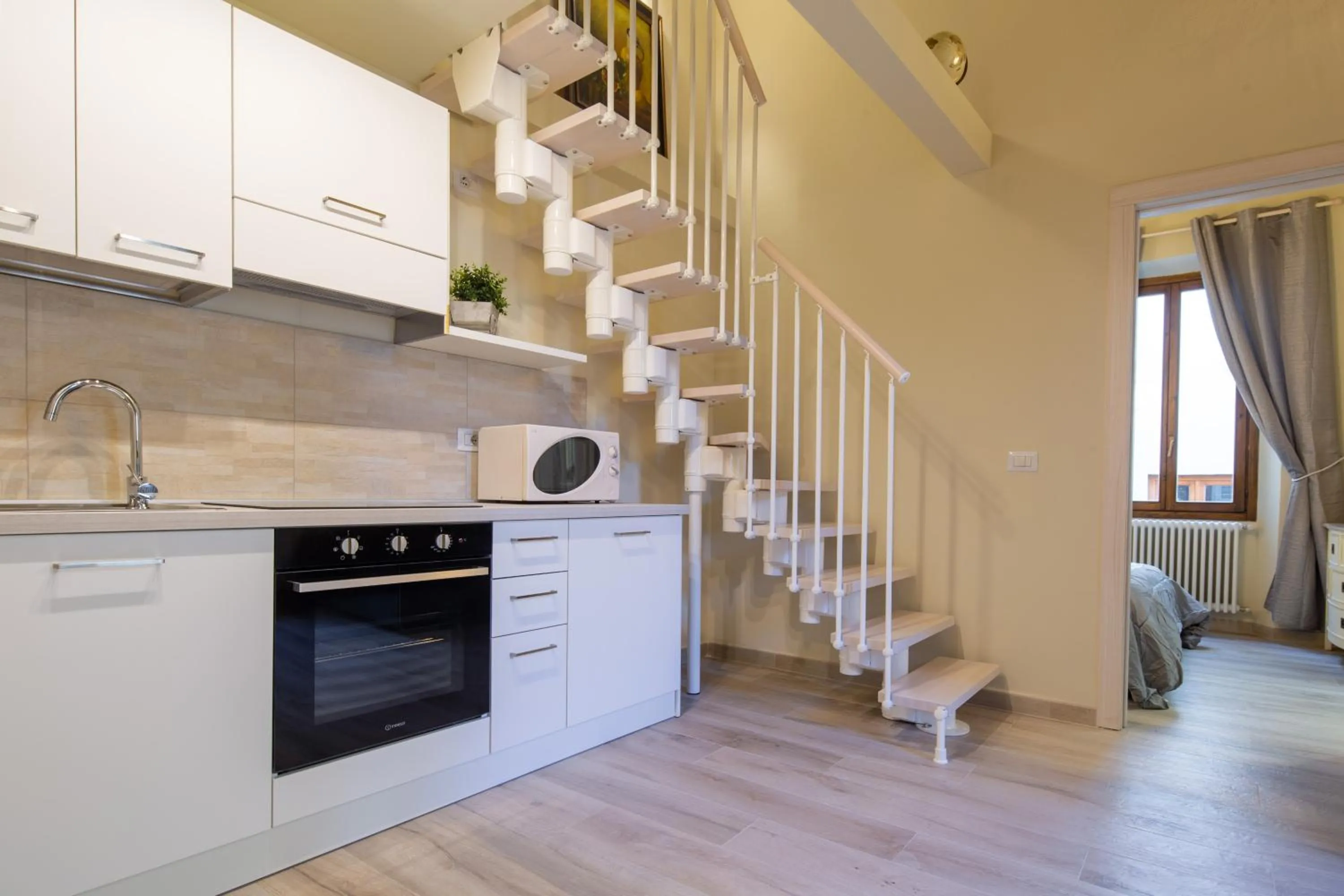 Kitchen or kitchenette in Duomo Apartments by Mmega