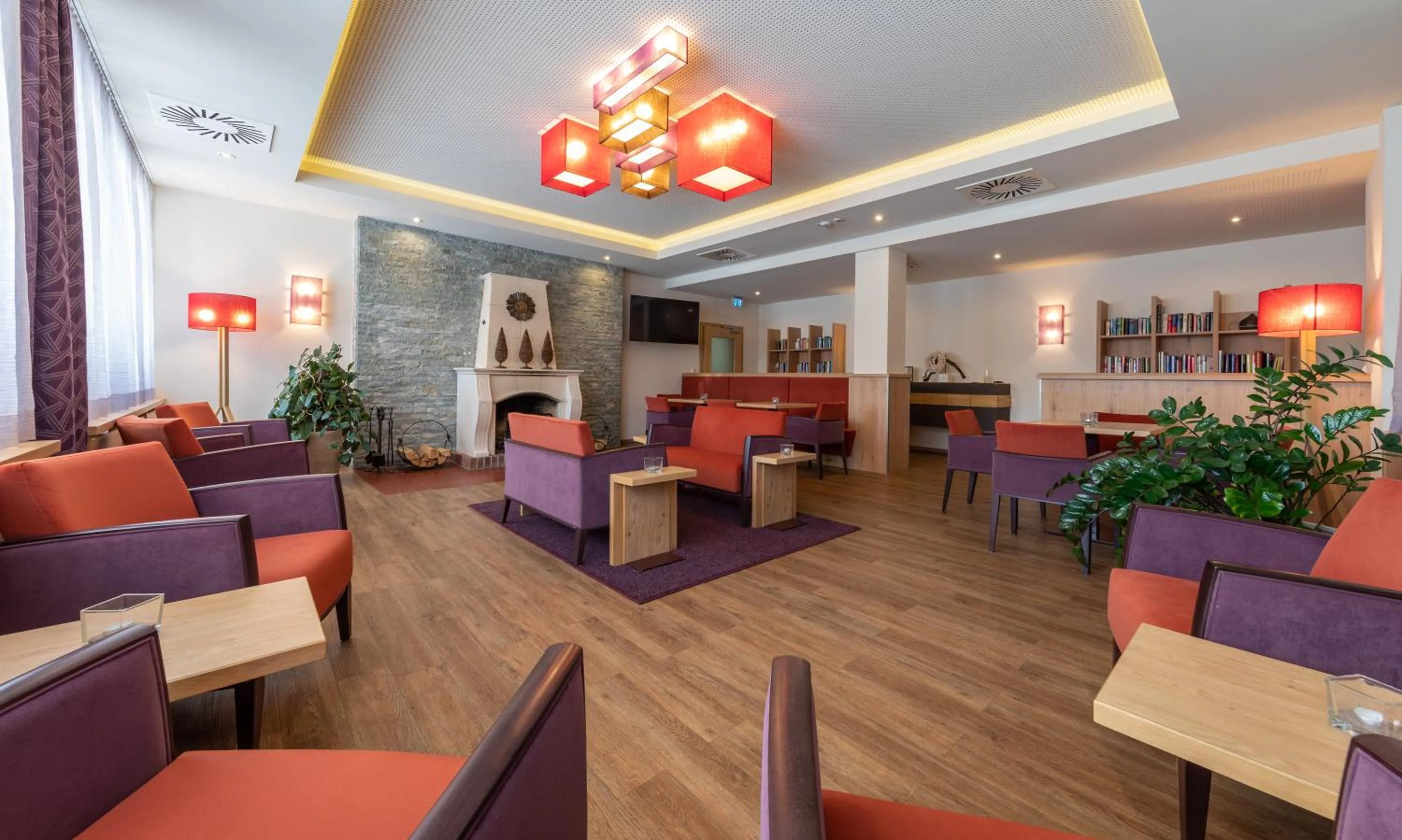 Communal lounge/ TV room in Hotel-Restaurant Grimmingblick