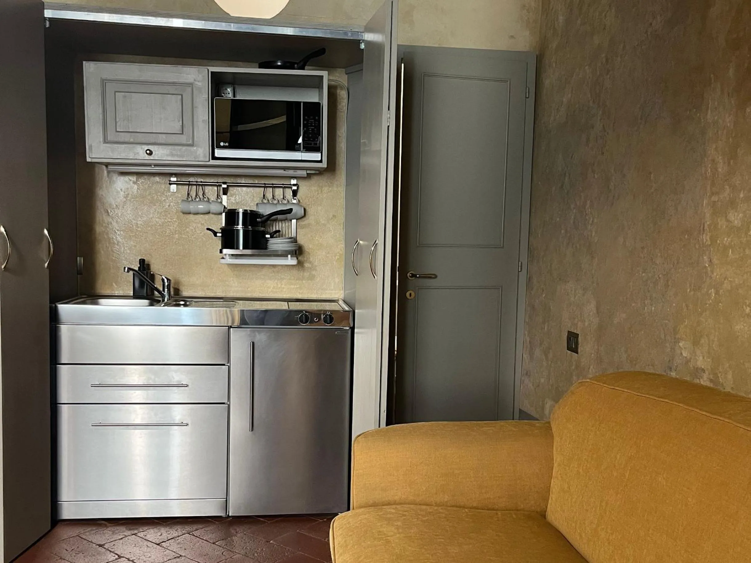 Kitchen or kitchenette in Numa Florence Palazzo San Niccolò