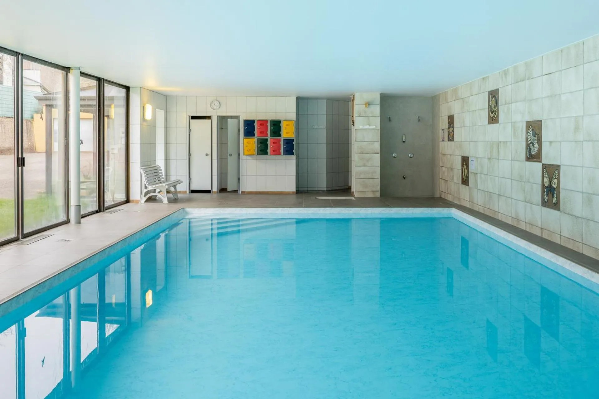 Pool view in Logis Hostellerie Motel Au Bois Le Sire