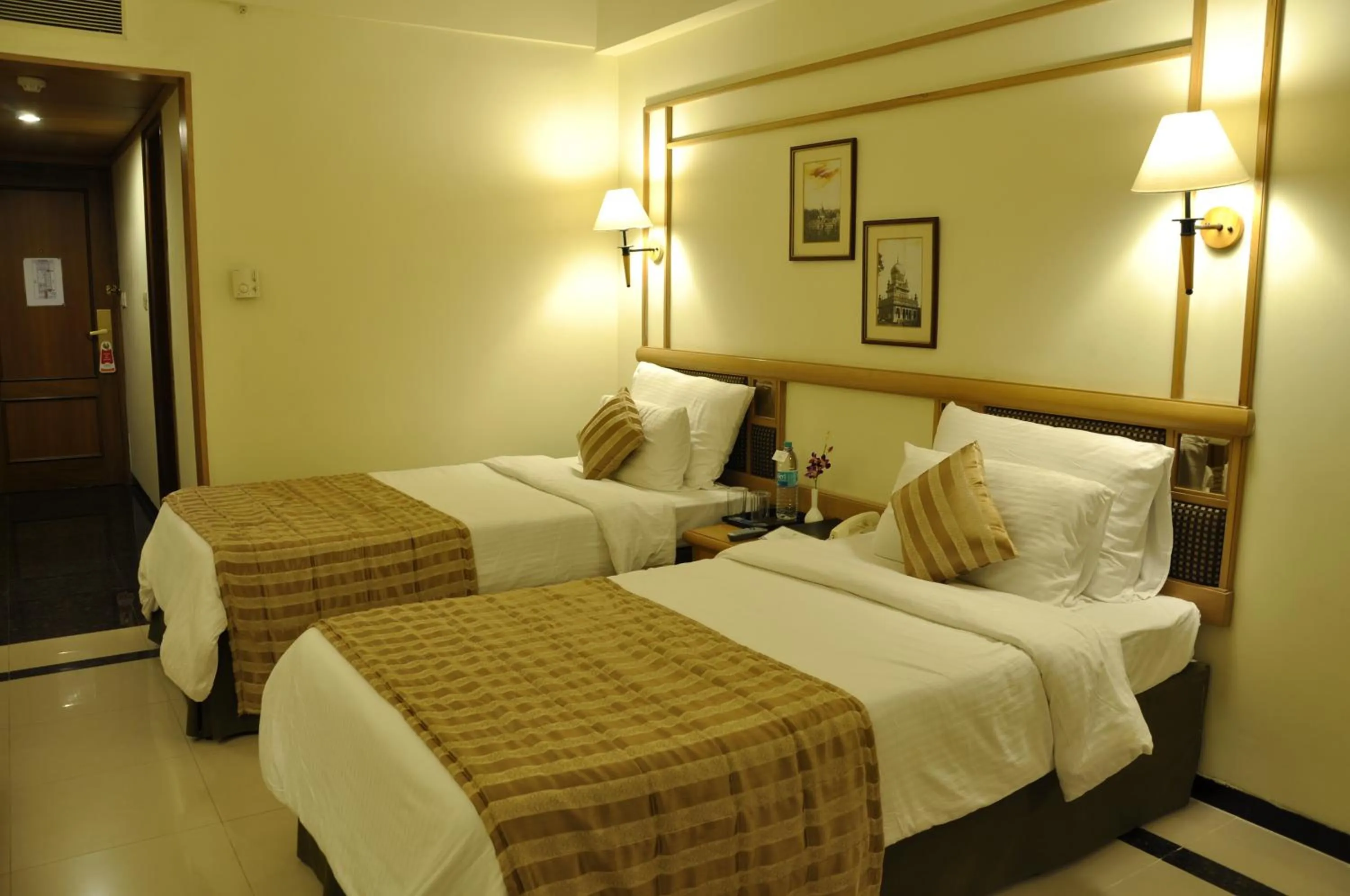 Bed in Aditya Park-A Sarovar Portico Hotel