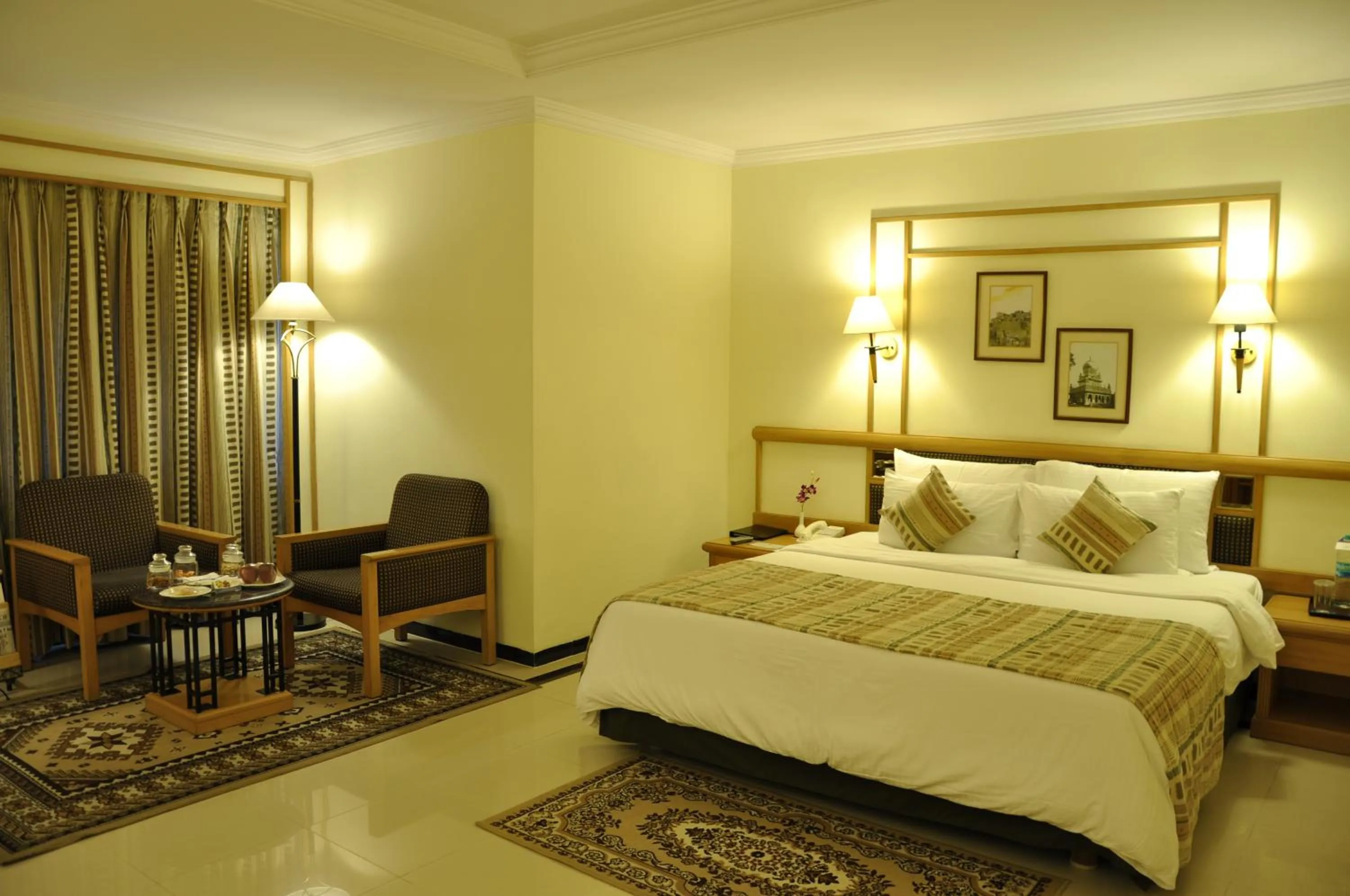 Bed in Aditya Park-A Sarovar Portico Hotel