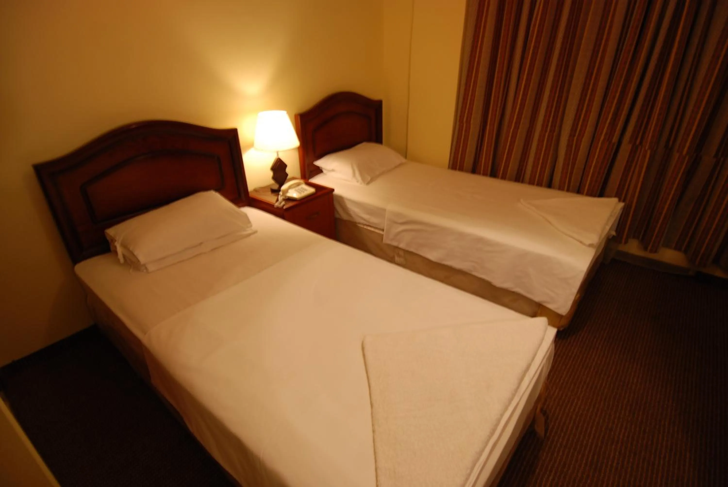 Bed in Al Rashid Hotel