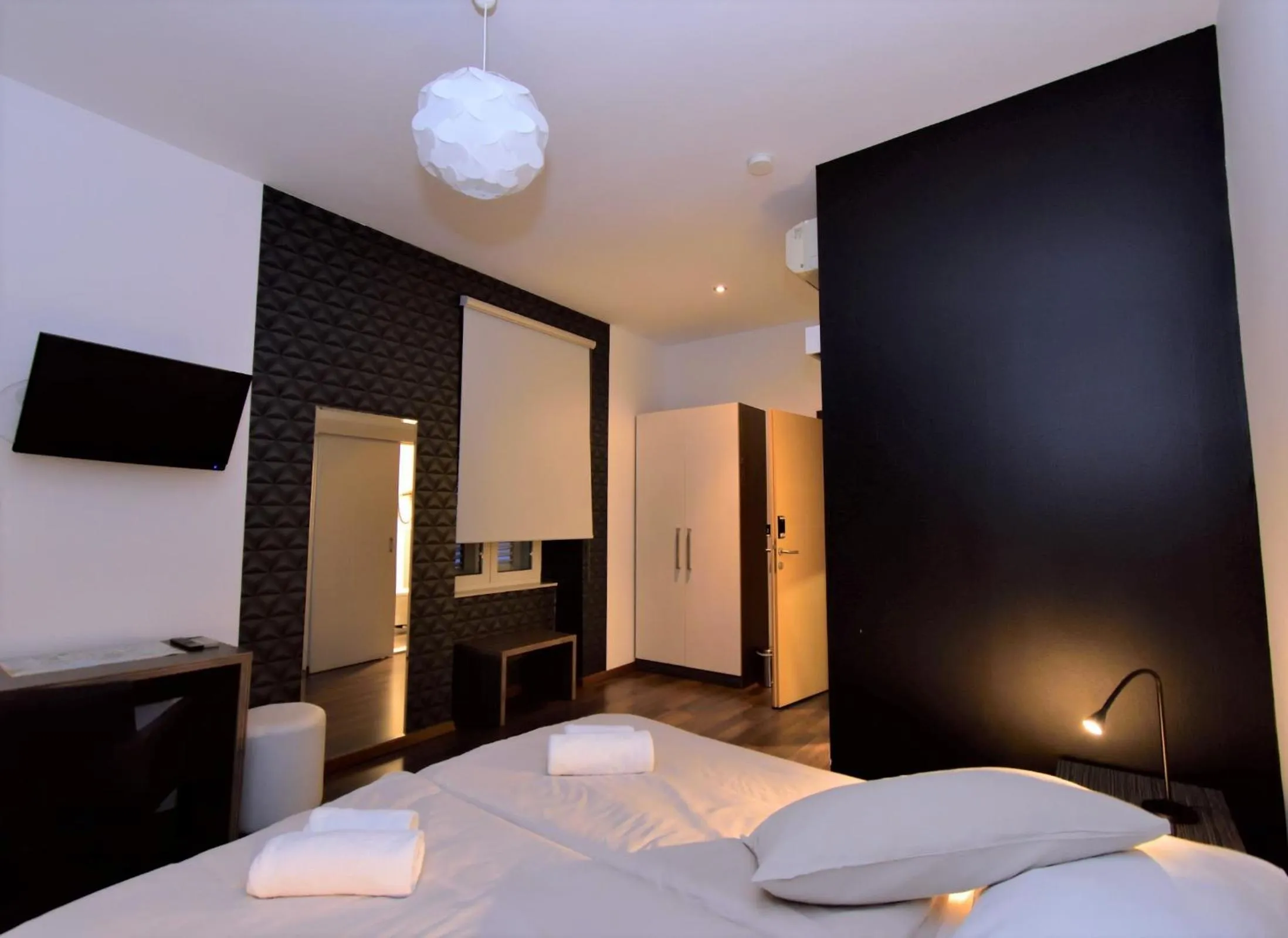 Bed in Marmontova Luxury Rooms