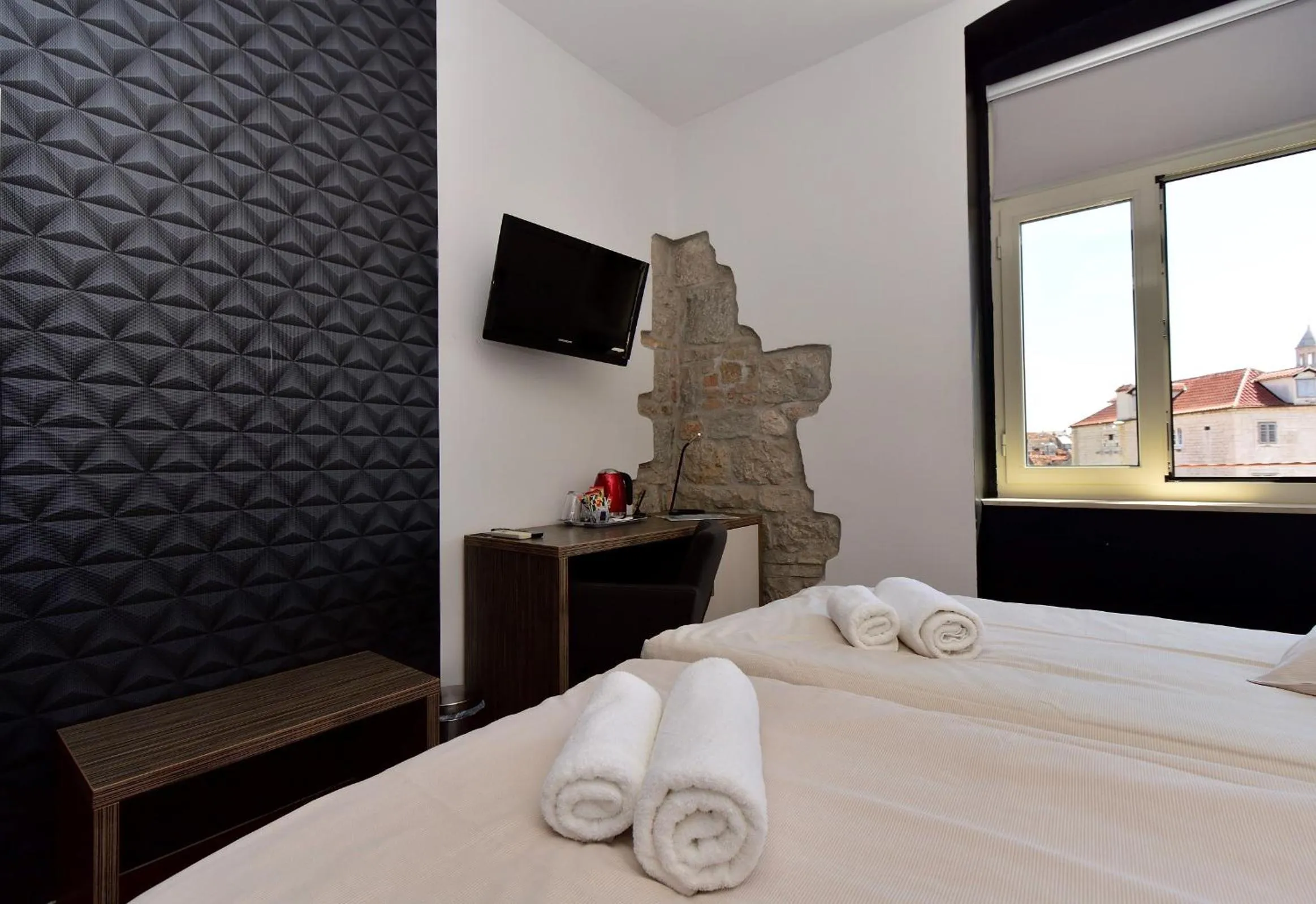 Bed in Marmontova Luxury Rooms