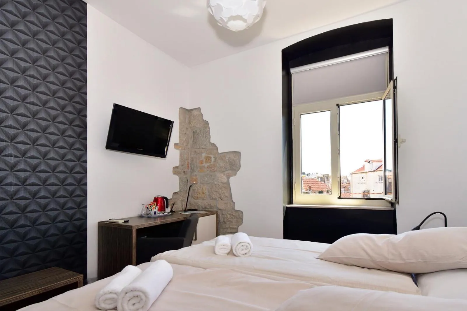 Bed in Marmontova Luxury Rooms