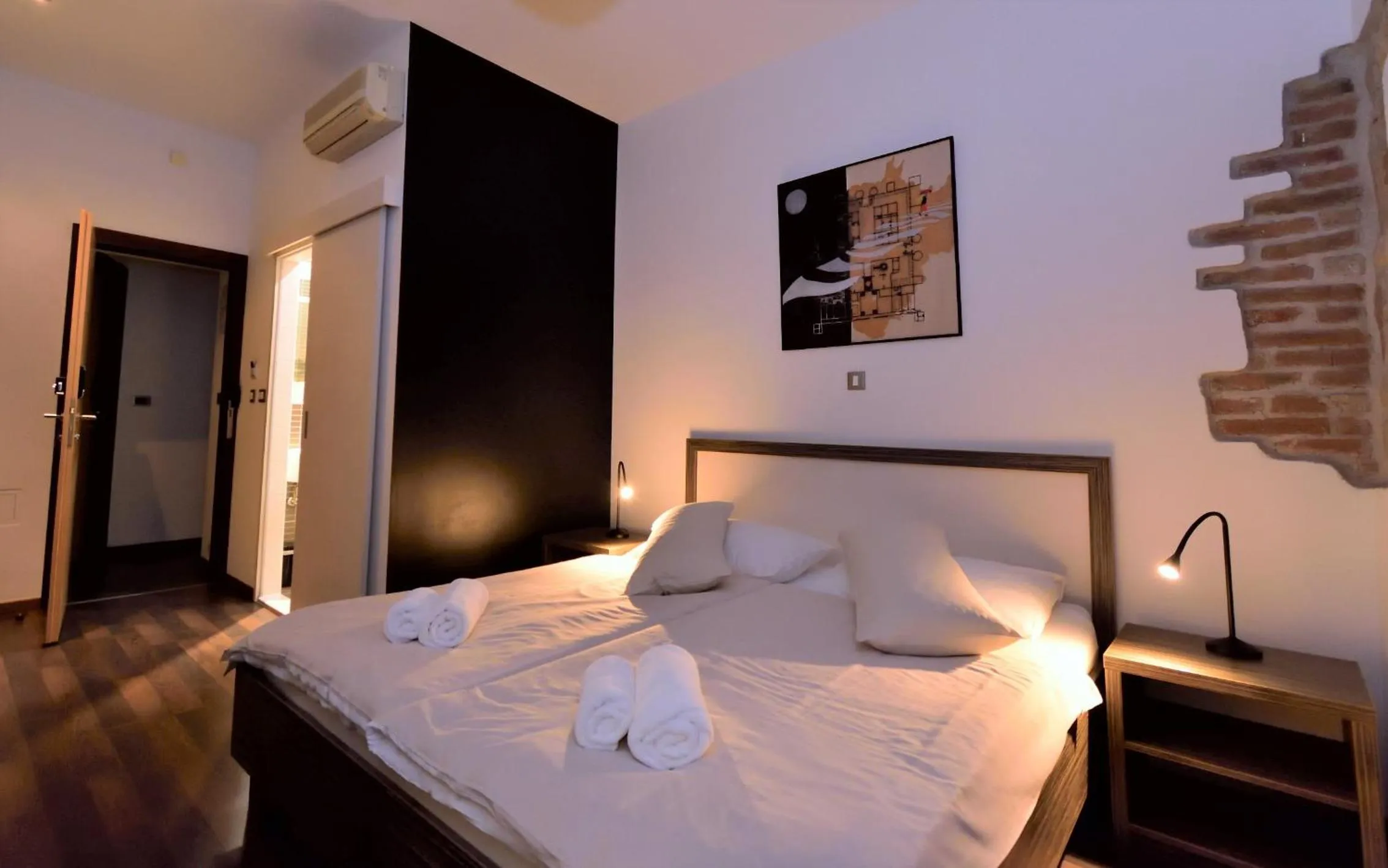 Bed in Marmontova Luxury Rooms