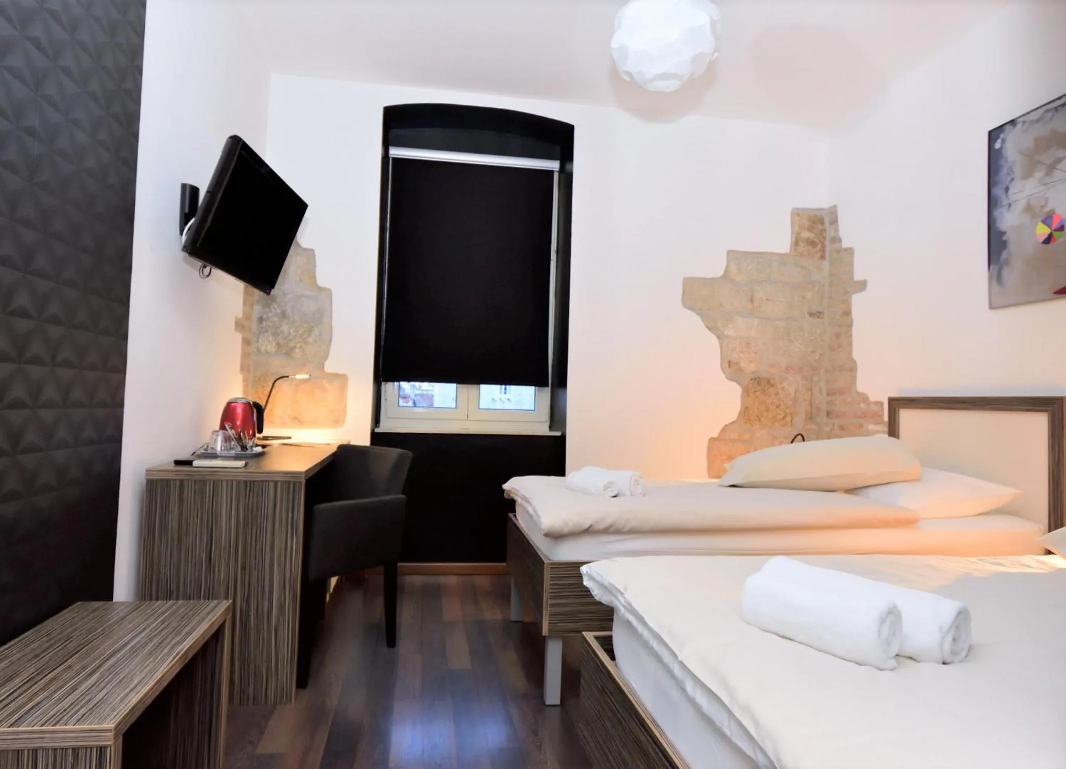 Bed in Marmontova Luxury Rooms