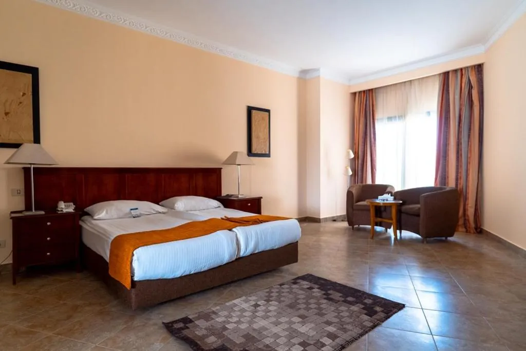 Bed in Swiss Inn Plaza Hotel