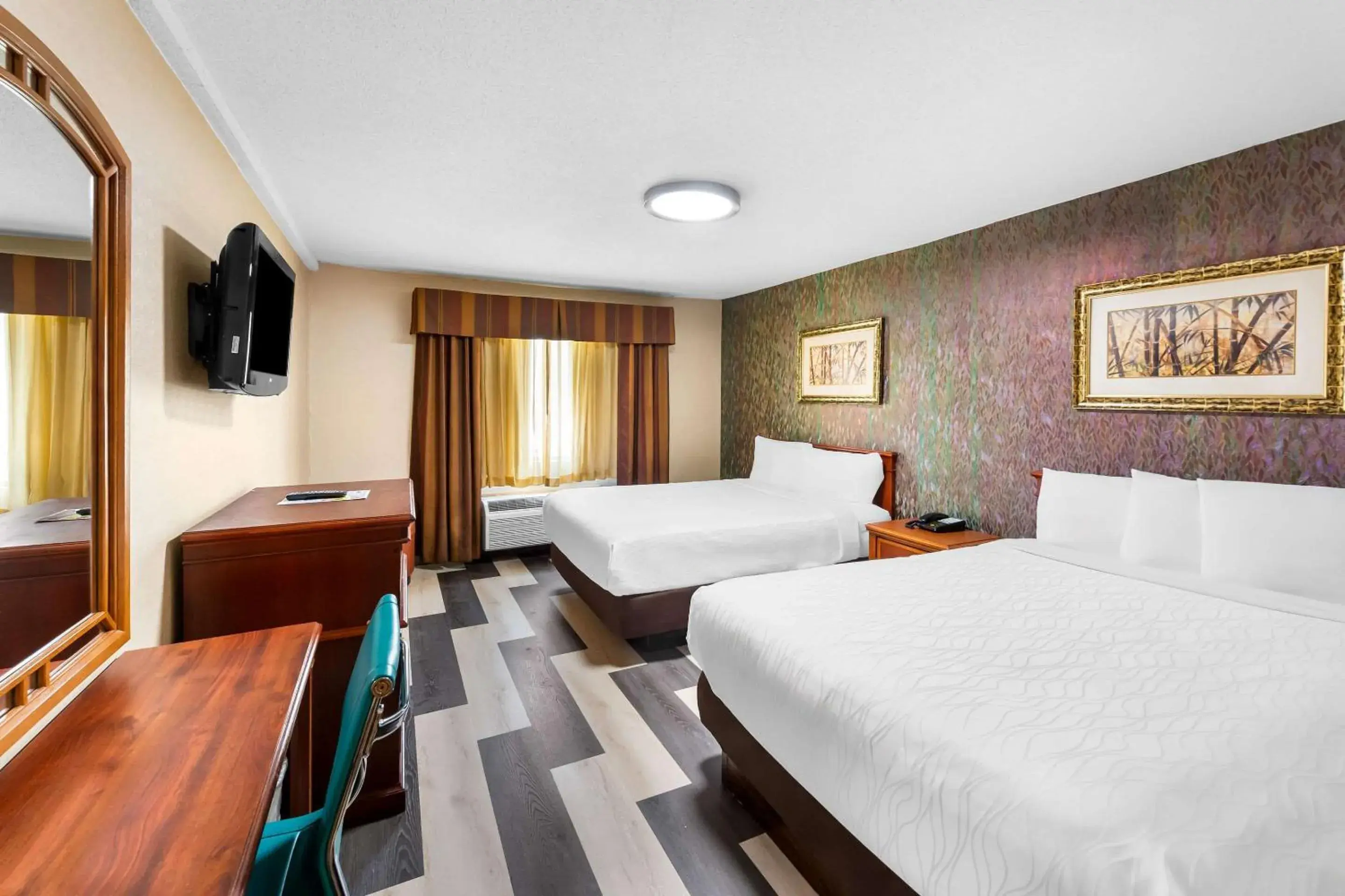 Queen Room with Two Queen Beds - Non-Smoking in Rodeway Inn Capri Queen Room with Two Queen Beds - Non-Smoking in Rodeway Inn Capri