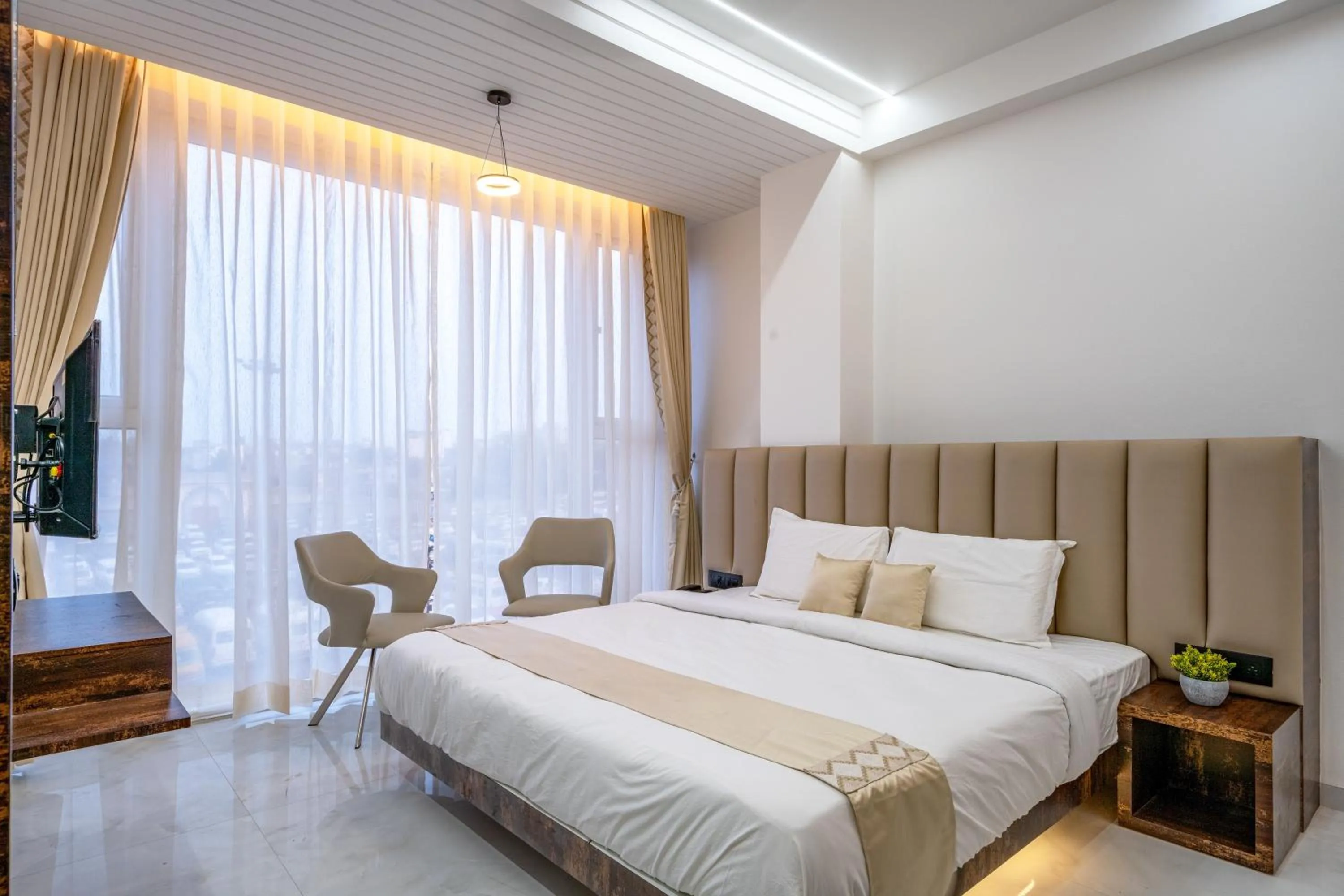 Bed in Hotel Darshan Executive