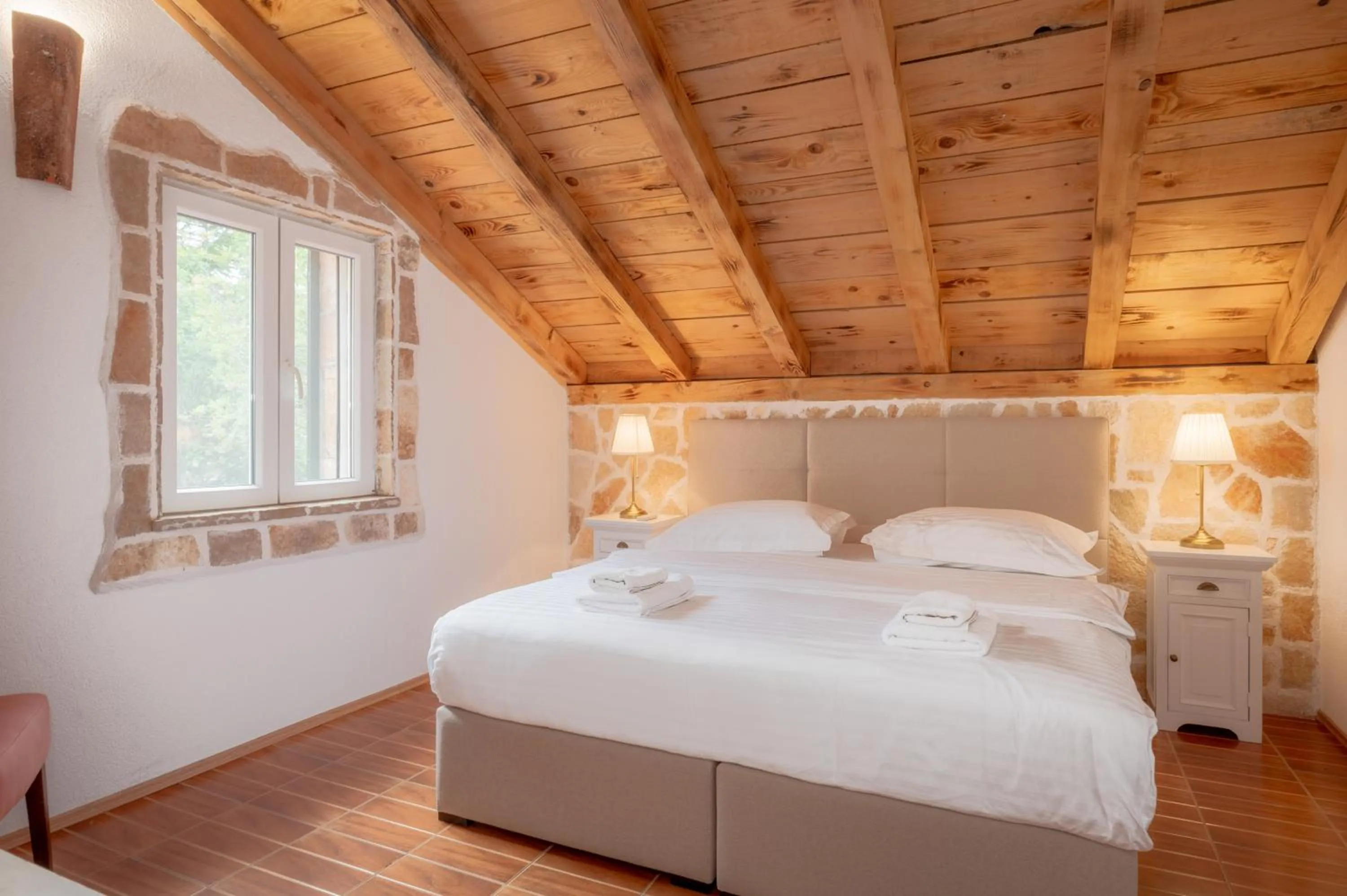 Bed in Nono Ban Boutique Hotel & Villas