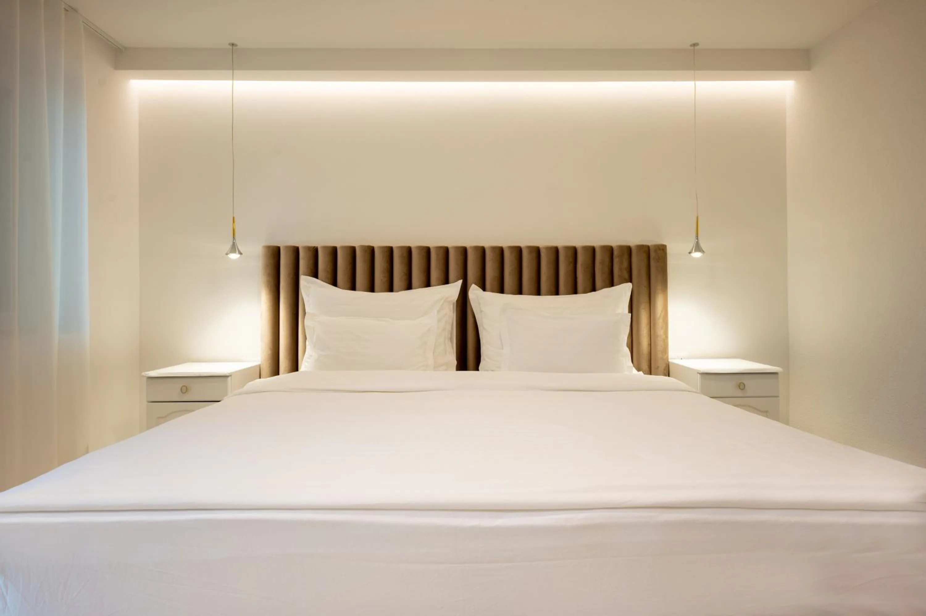 Bed in Nono Ban Boutique Hotel & Villas