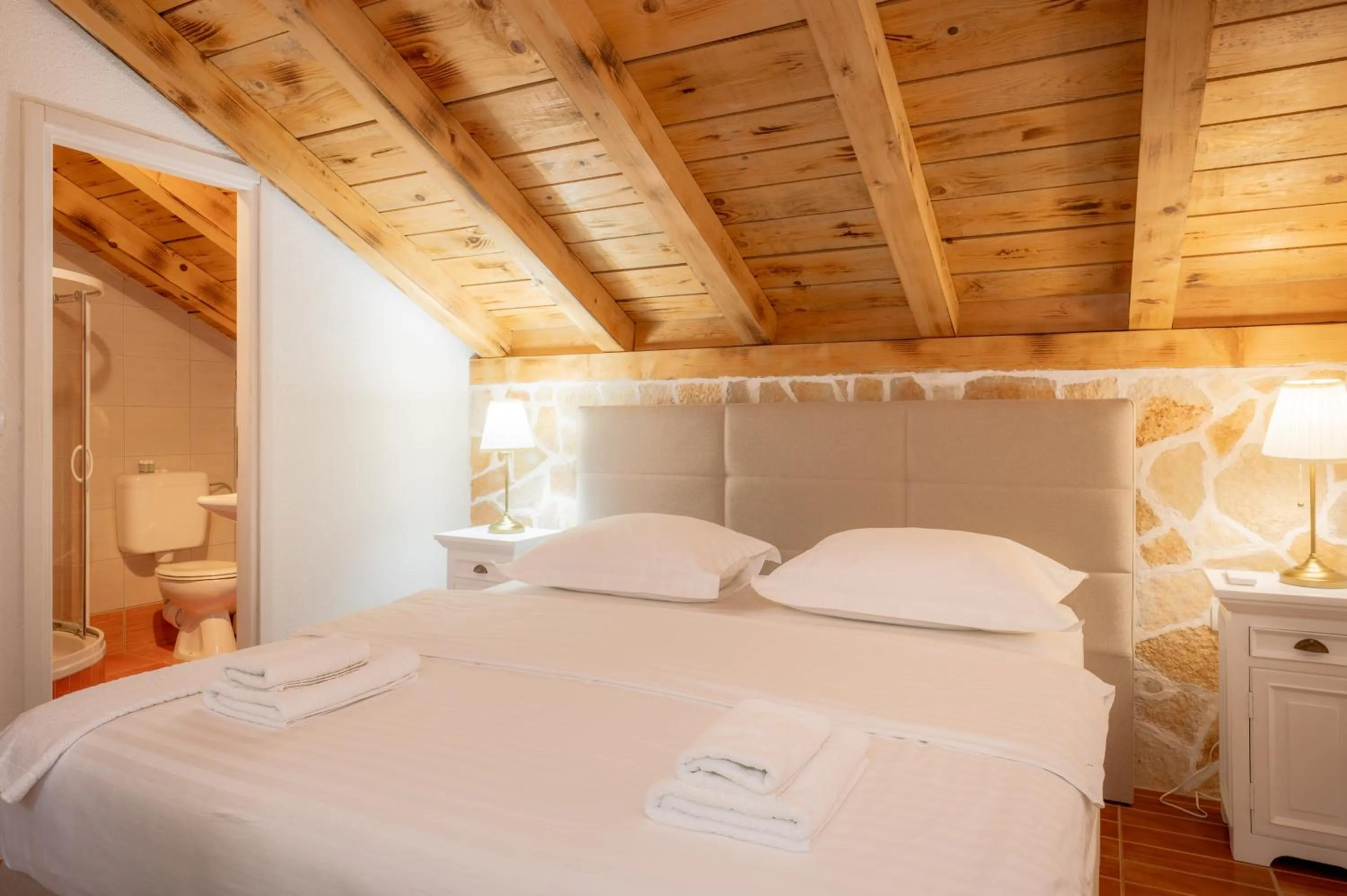 Bed in Nono Ban Boutique Hotel & Villas