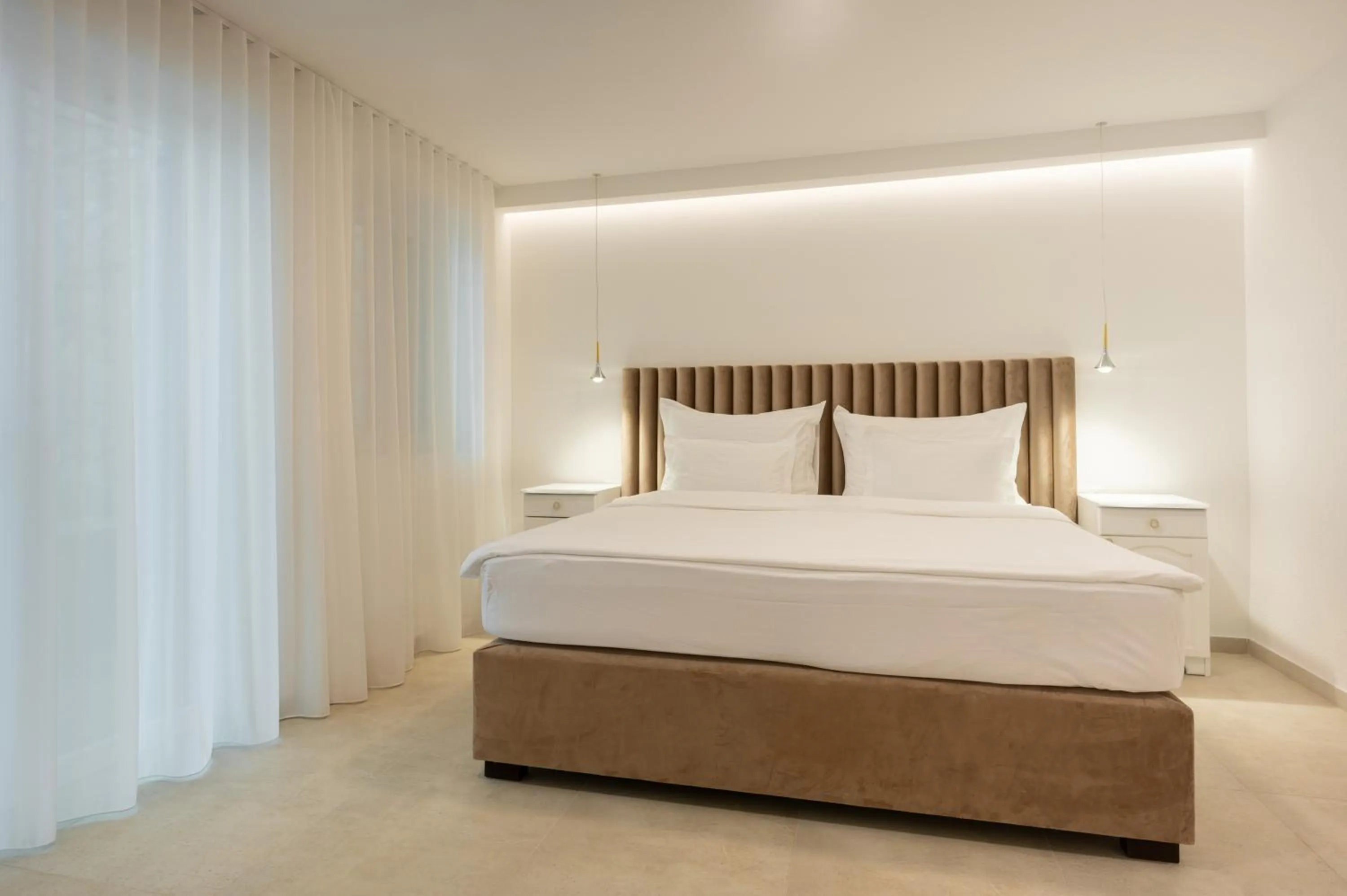 Bed in Nono Ban Boutique Hotel & Villas