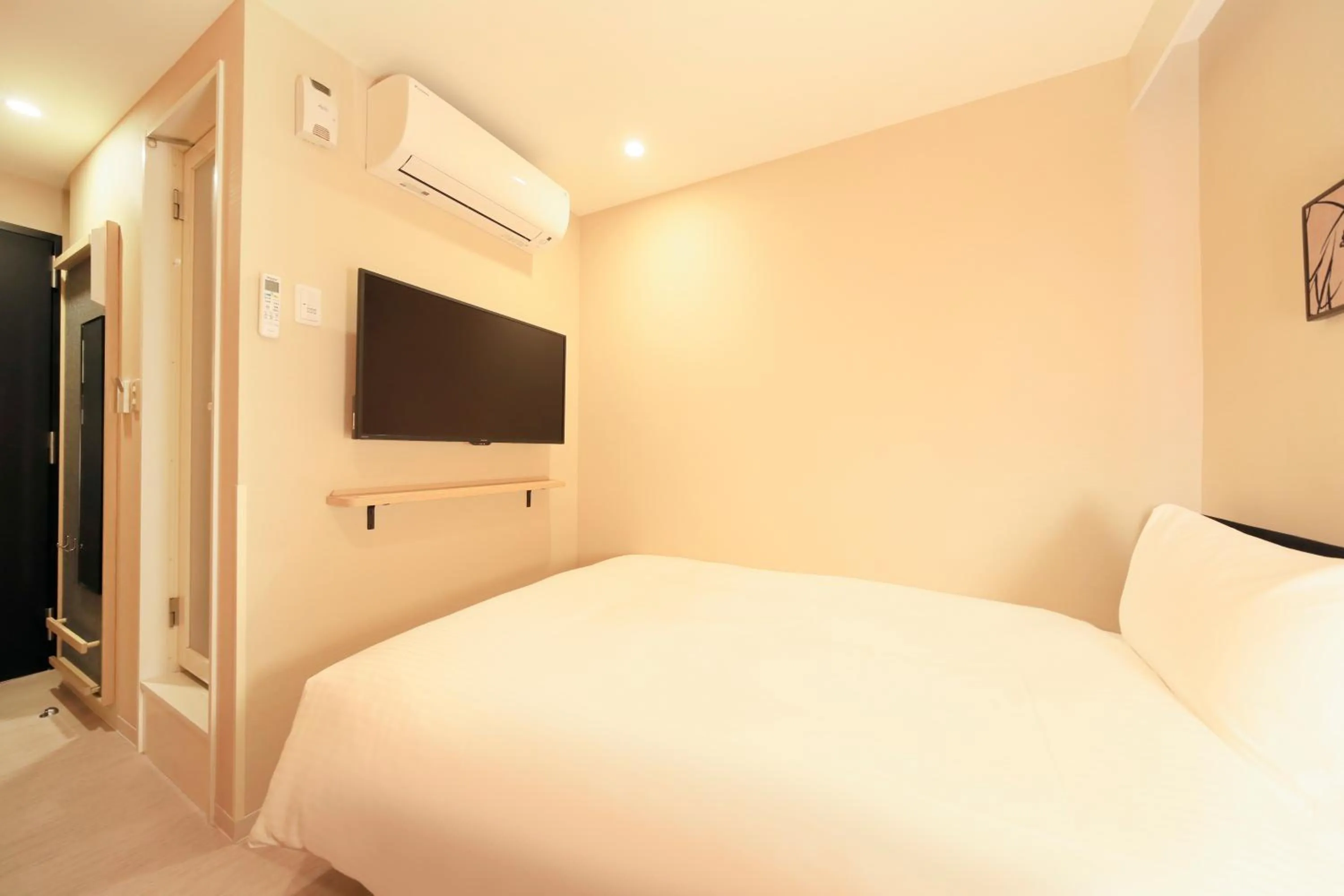 Bed in Hotel Nihonbashi Saibo