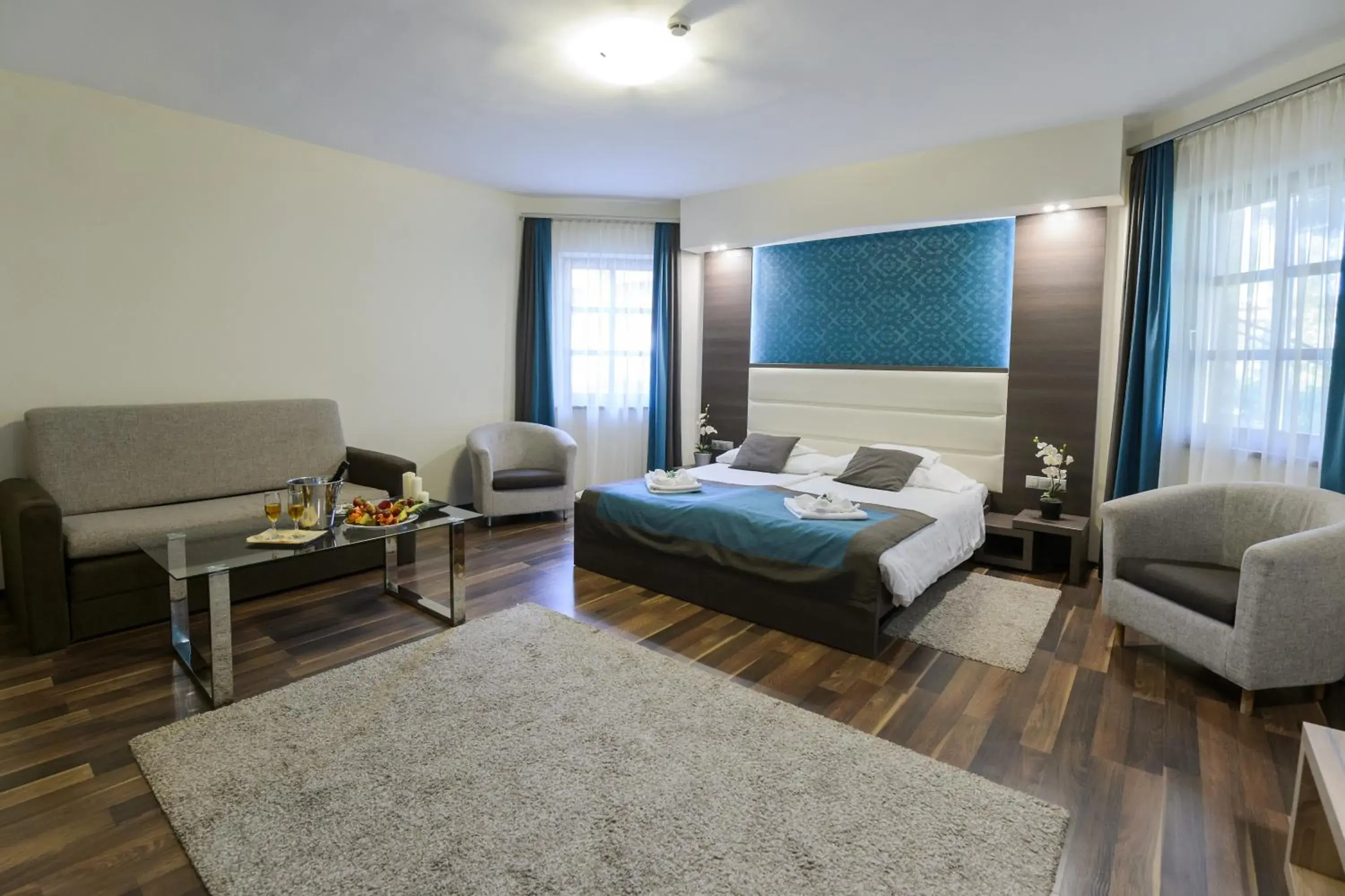 Deluxe Quadruple Room in Hotel Villa Völgy Wellness & Konferencia Deluxe Quadruple Room in Hotel Villa Völgy Wellness & Konferencia