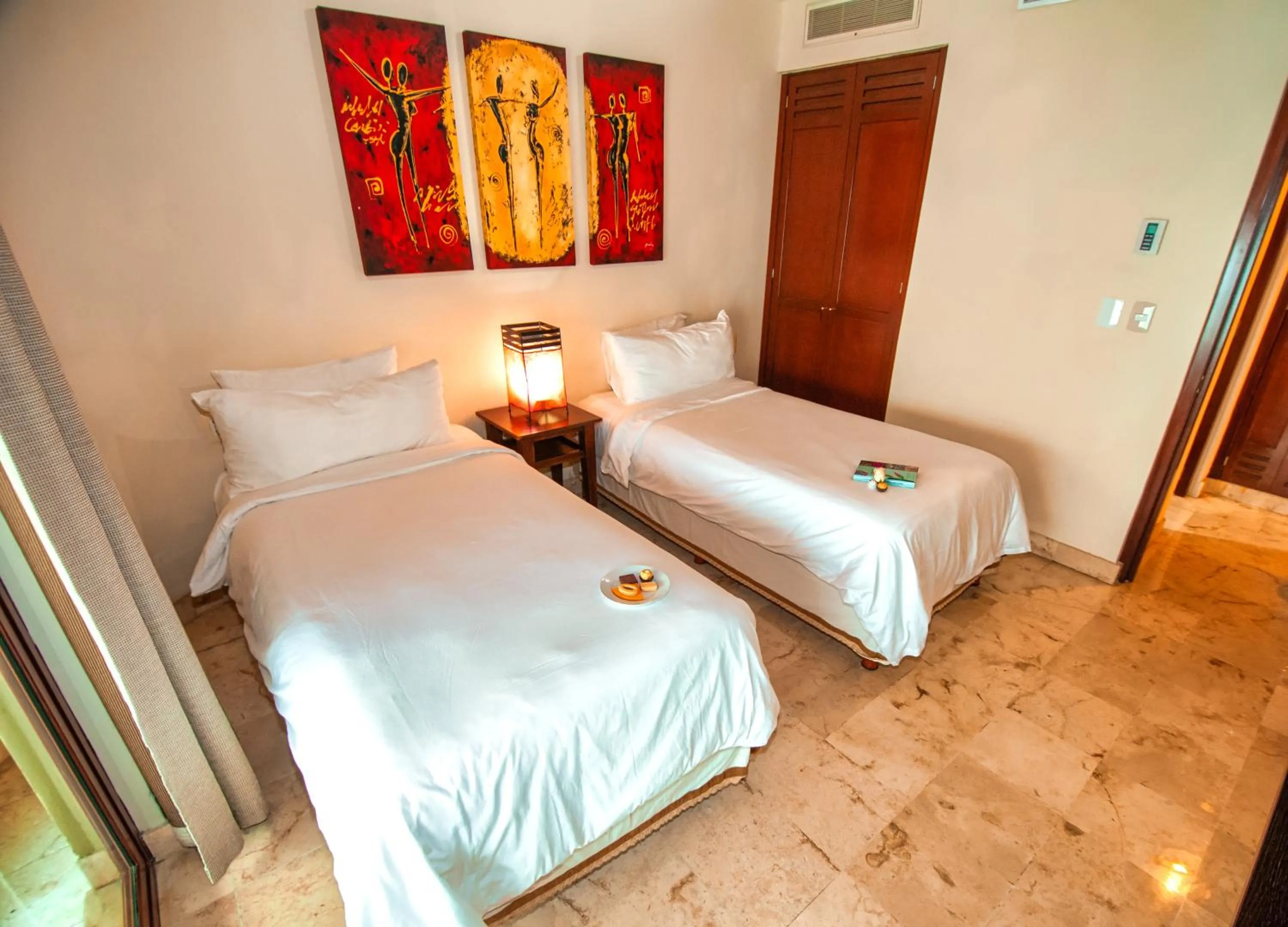 Bed in Maya Villa Condo Hotel and Beachclub