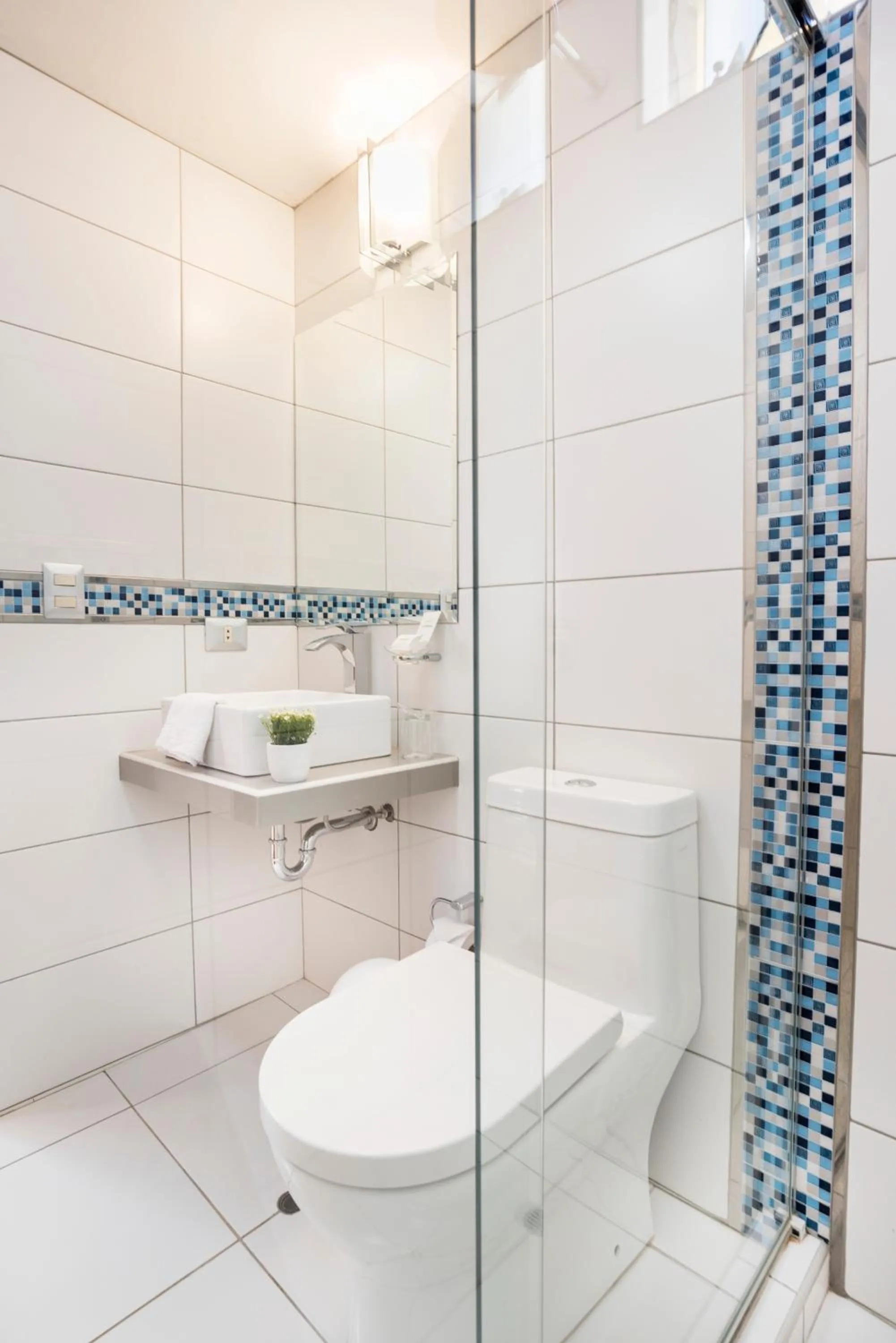 Shower in Natura Inn Hotel