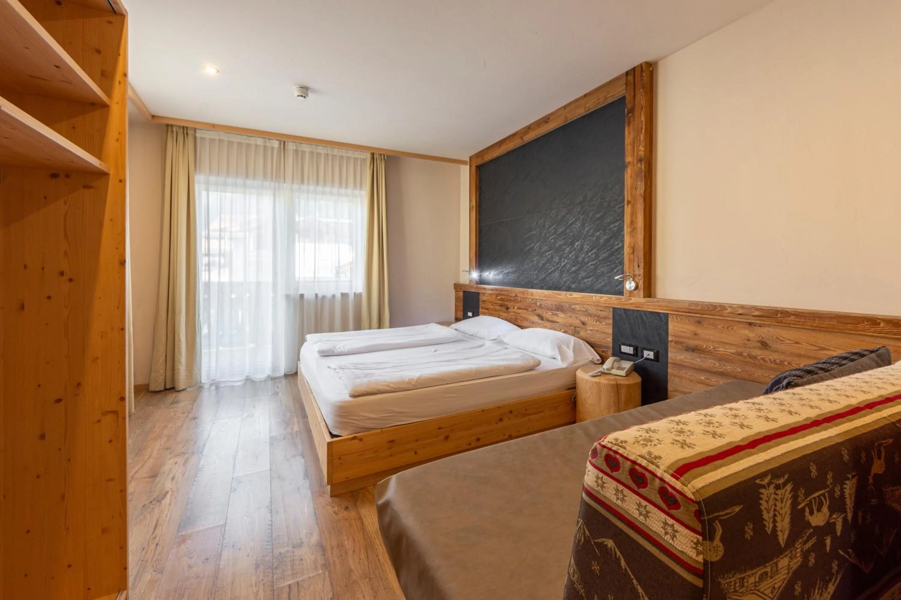 Bed in Park Hotel Avisio